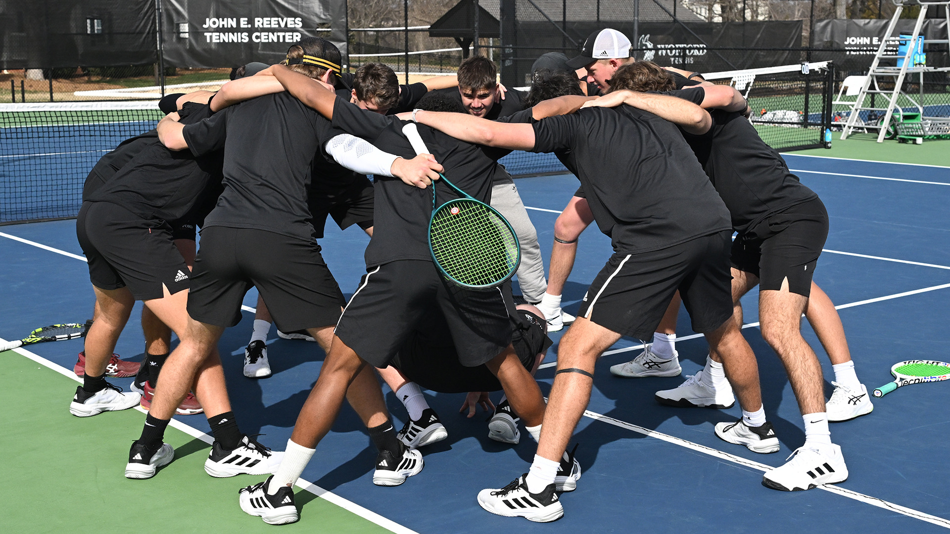 2025 mens tennis huddle vs NGU