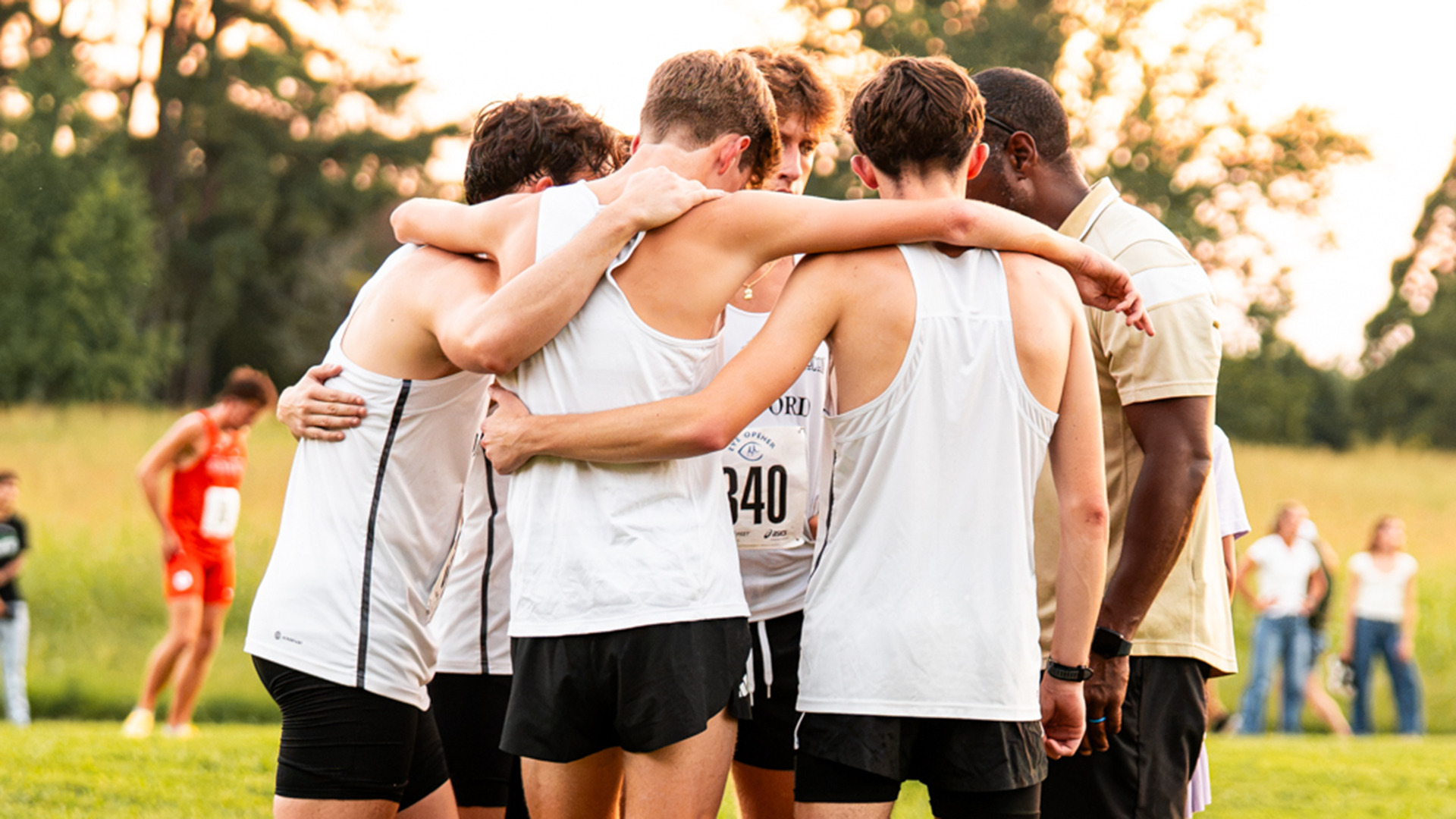 2026 mens XC huddle Eye Opener