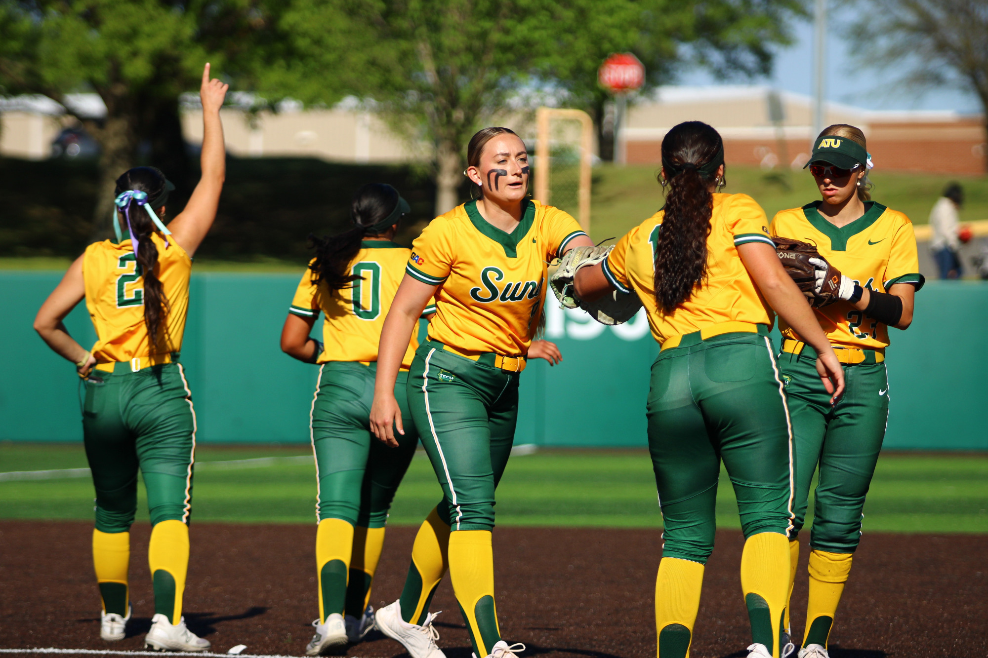 Alexis Findley dapping up Caroline Wilhelm