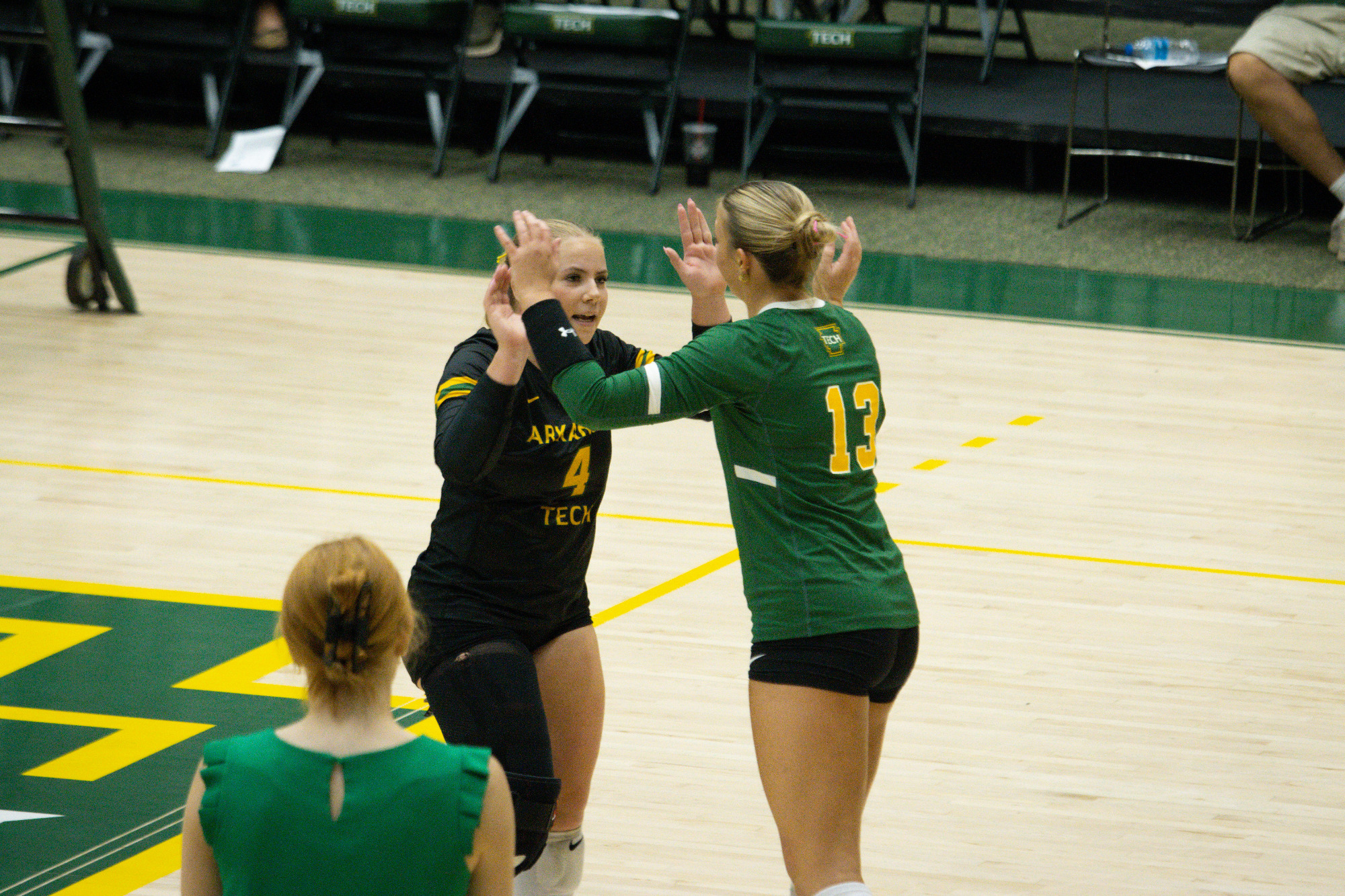 Sam Wojtowicz and Karis Brinlee high five (vs. NWSOU '26)