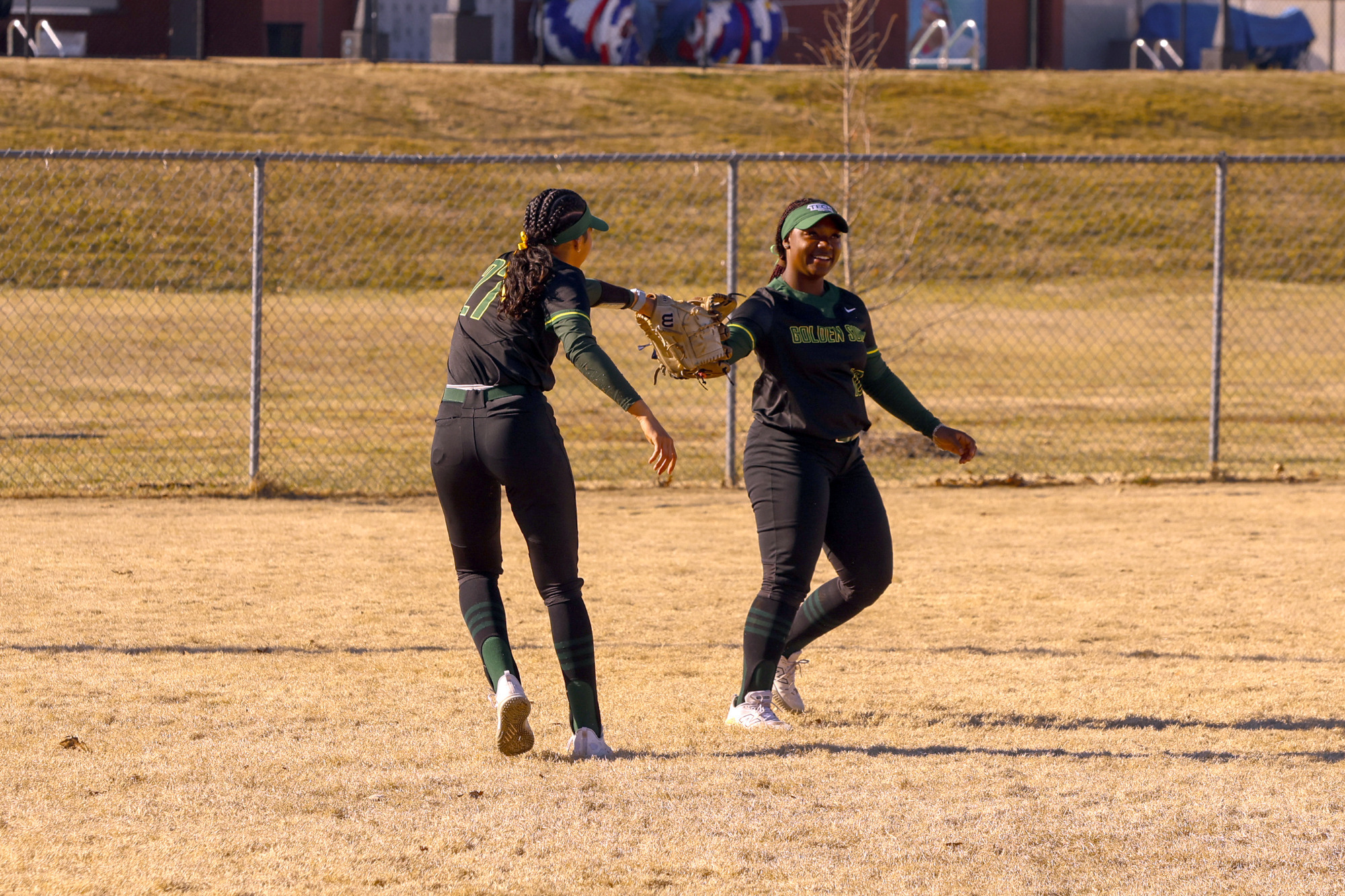Anna Winkfield and Aubree Jones dapping gloves in Bentonville