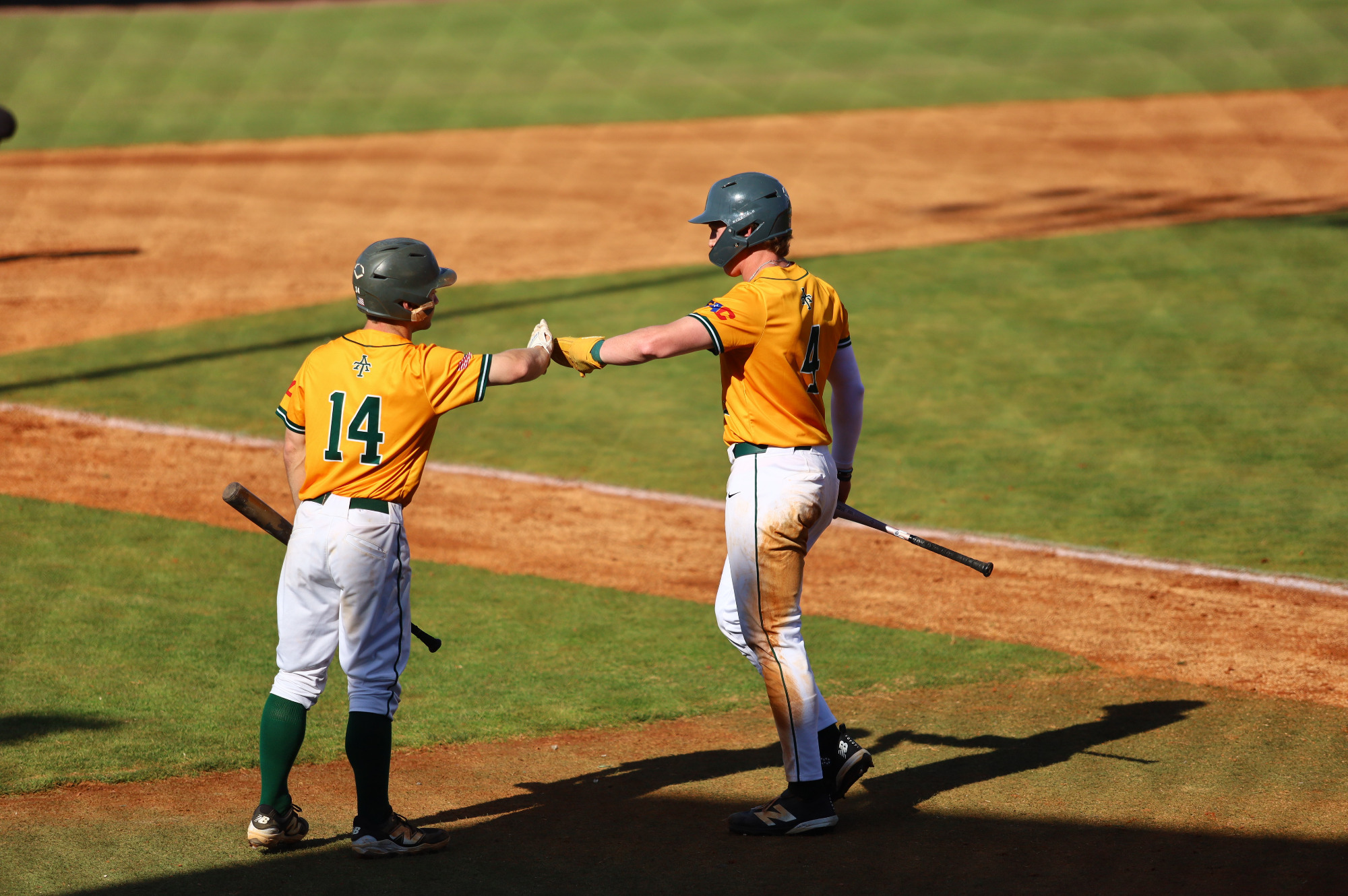 Kirby Jenkins and Cole Dawson high-five vs. Southwestern Oklahoma