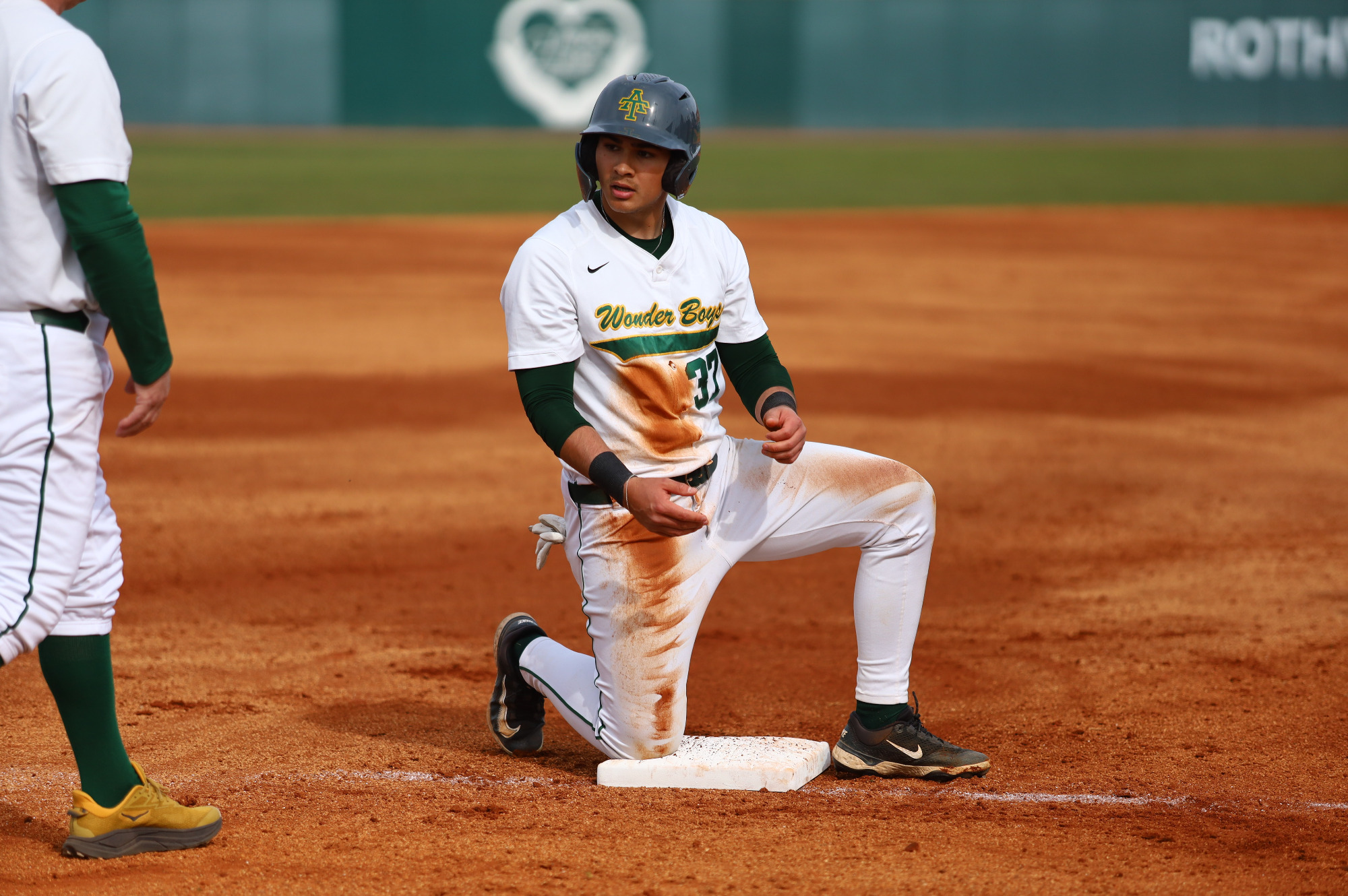 Braden Watkins slidding into 3rd base