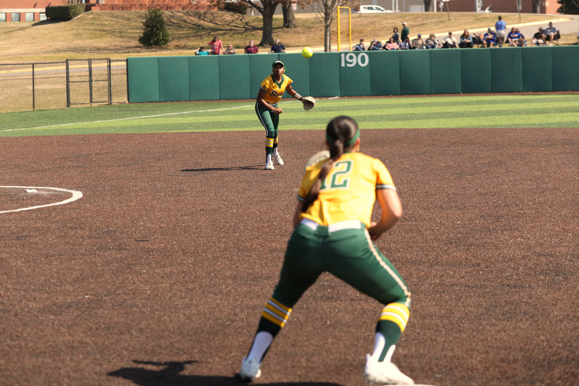 Miya Curry throwing to Caroline Wilhelm