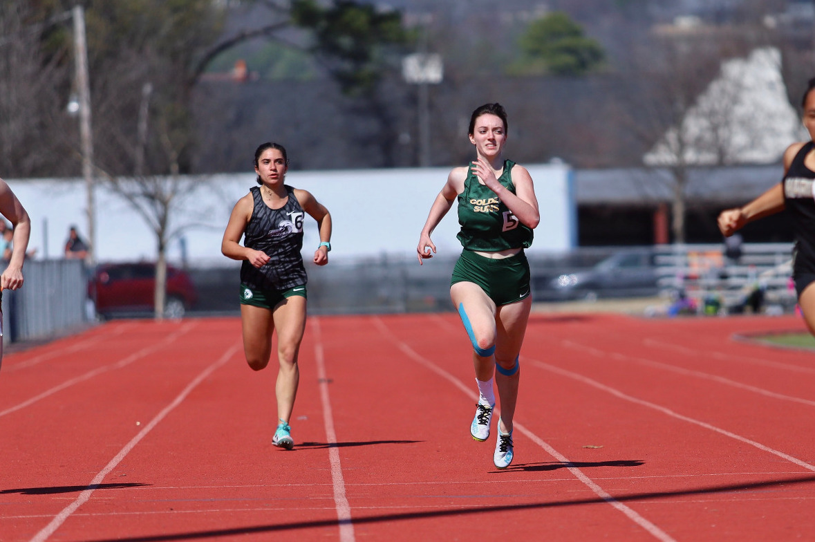 Breanne Anderson sprinting at Hendrix