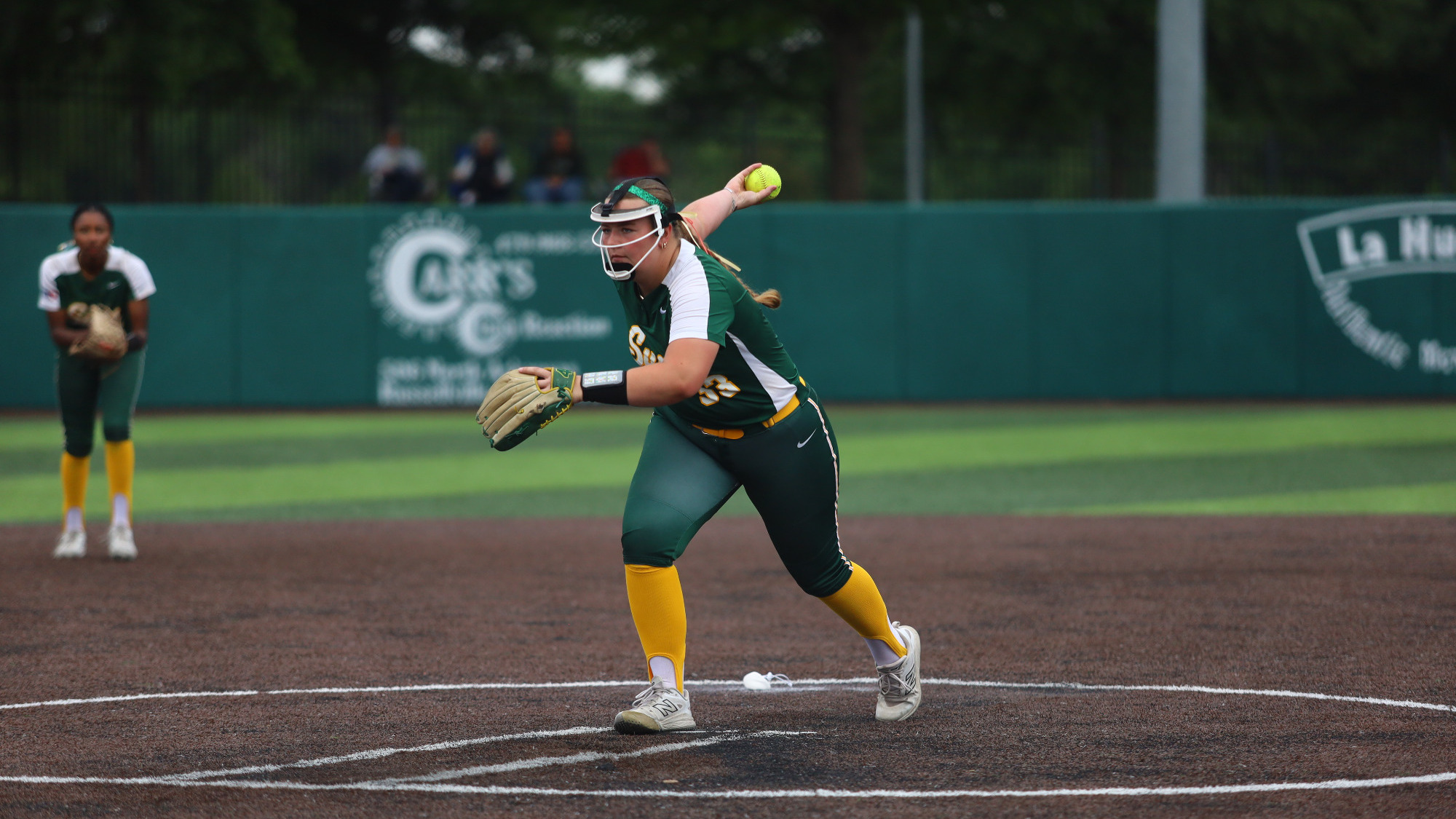 Aly White pitching vs. Harding