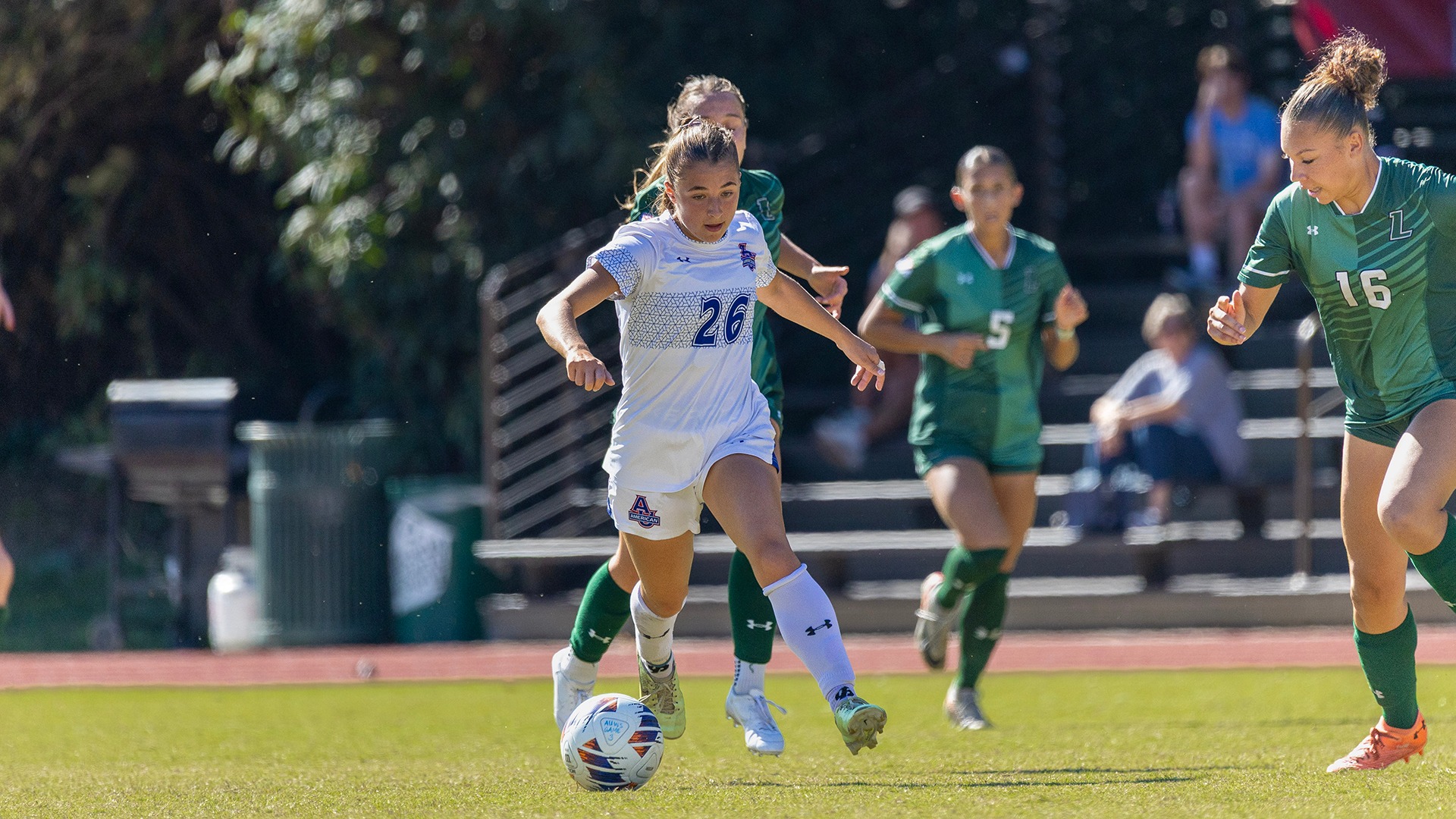 Phoebe Merrigan with the ball during a women's soccer game