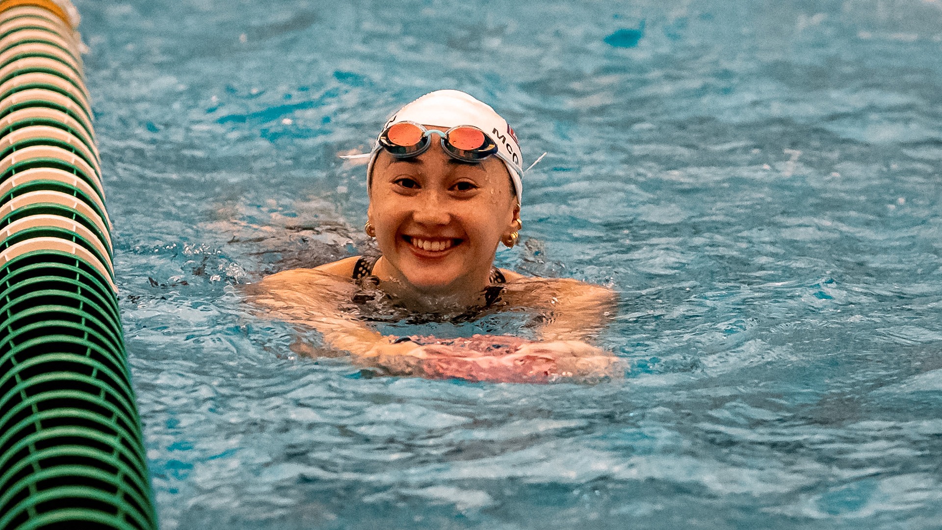 Isabel McGovern smiling after a race for swimming