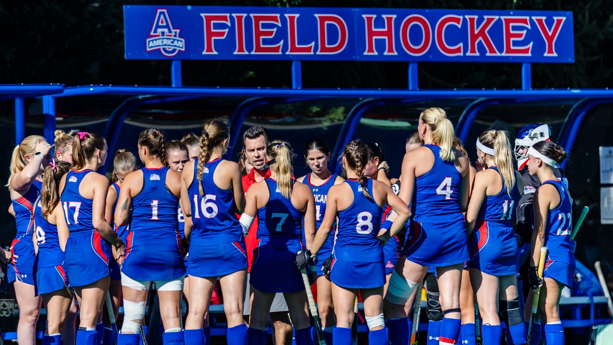 Field Hockey Huddles together on the field before a game.