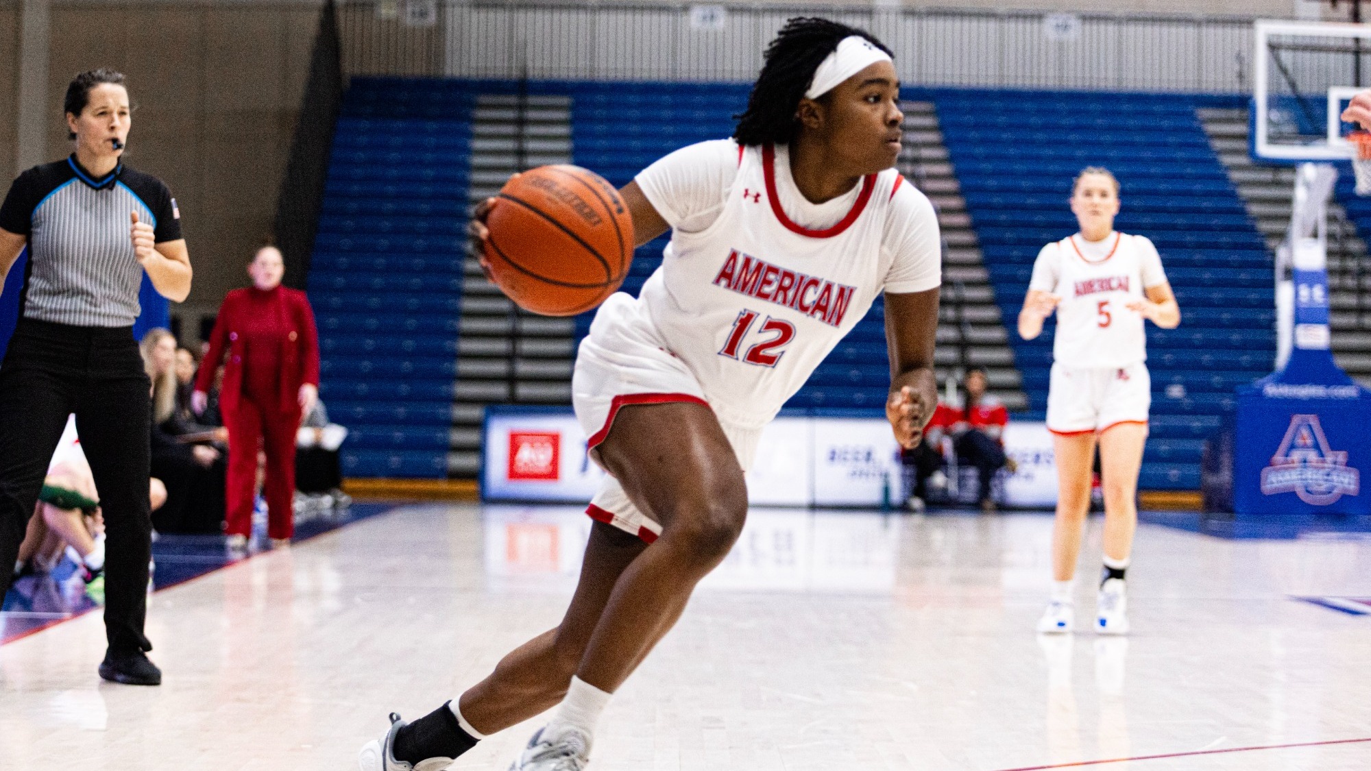 Madisyn Moore-Nicholson driving towards the basket against William and Mary in Bender Arena.