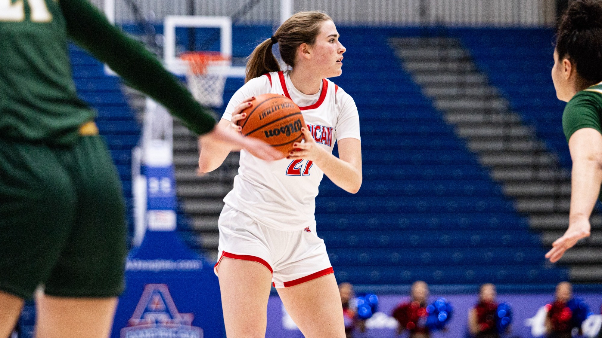 Charlotte Tuhy looking for a play on the floor against William and Mary.