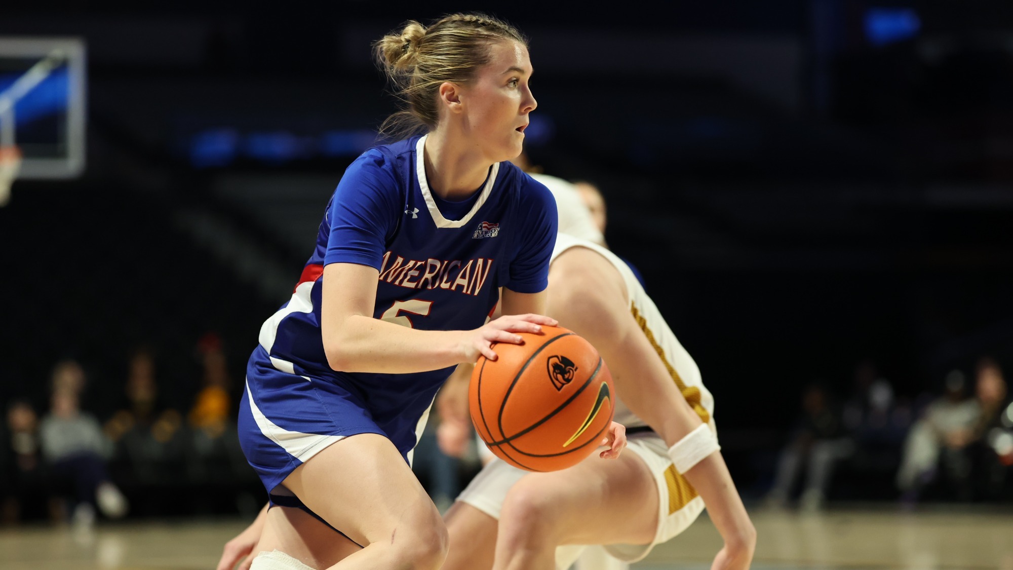 Molly Driscoll driving down the court against the VCU Rams in Richmond.