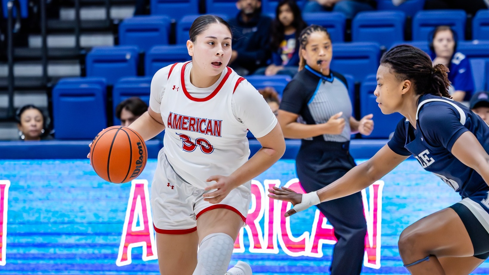 Lexi Salazar driving down the court against Yale in Bender Arena.