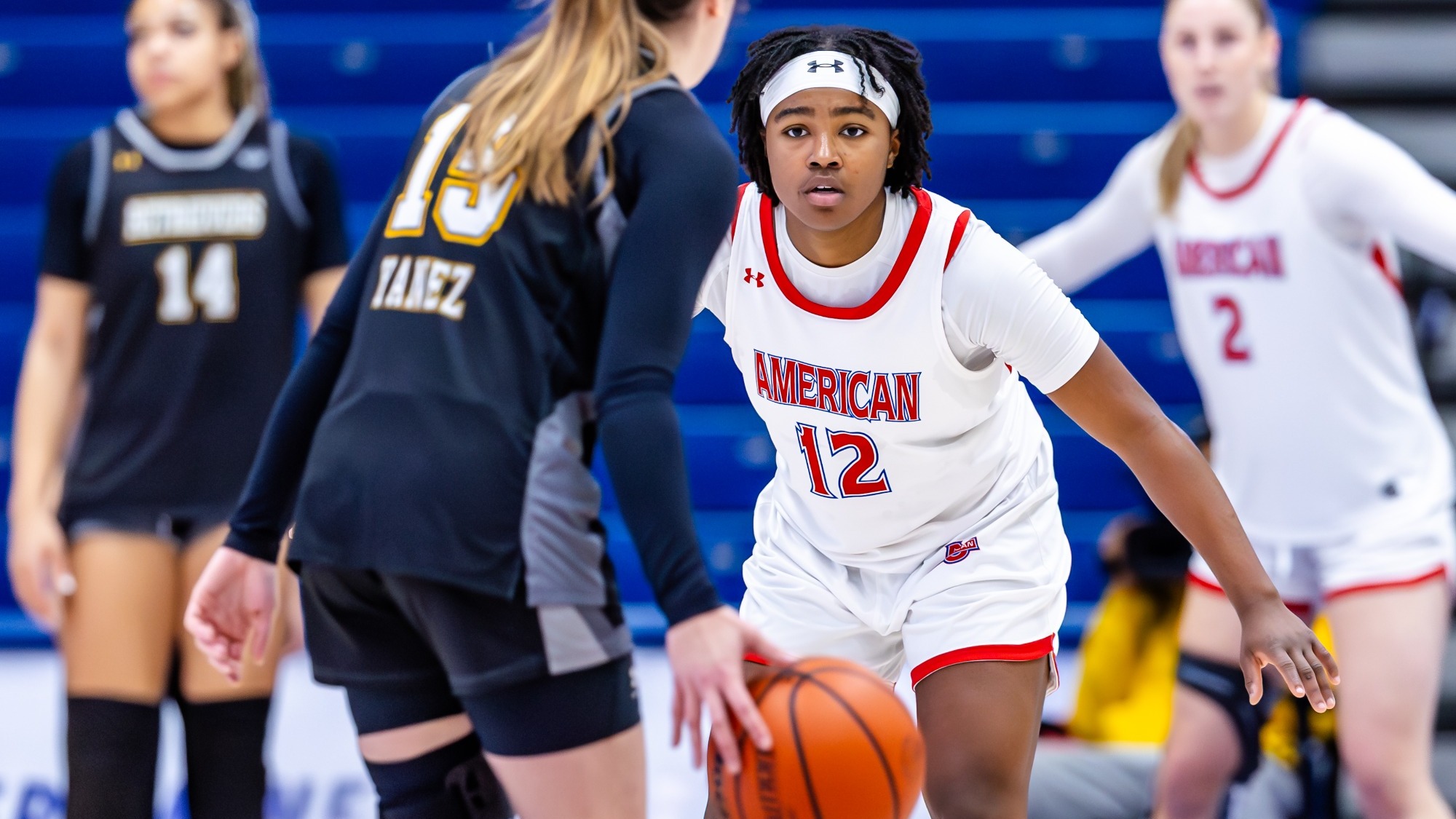 Madisyn Moore-Nicholson guarding a UMBC player.