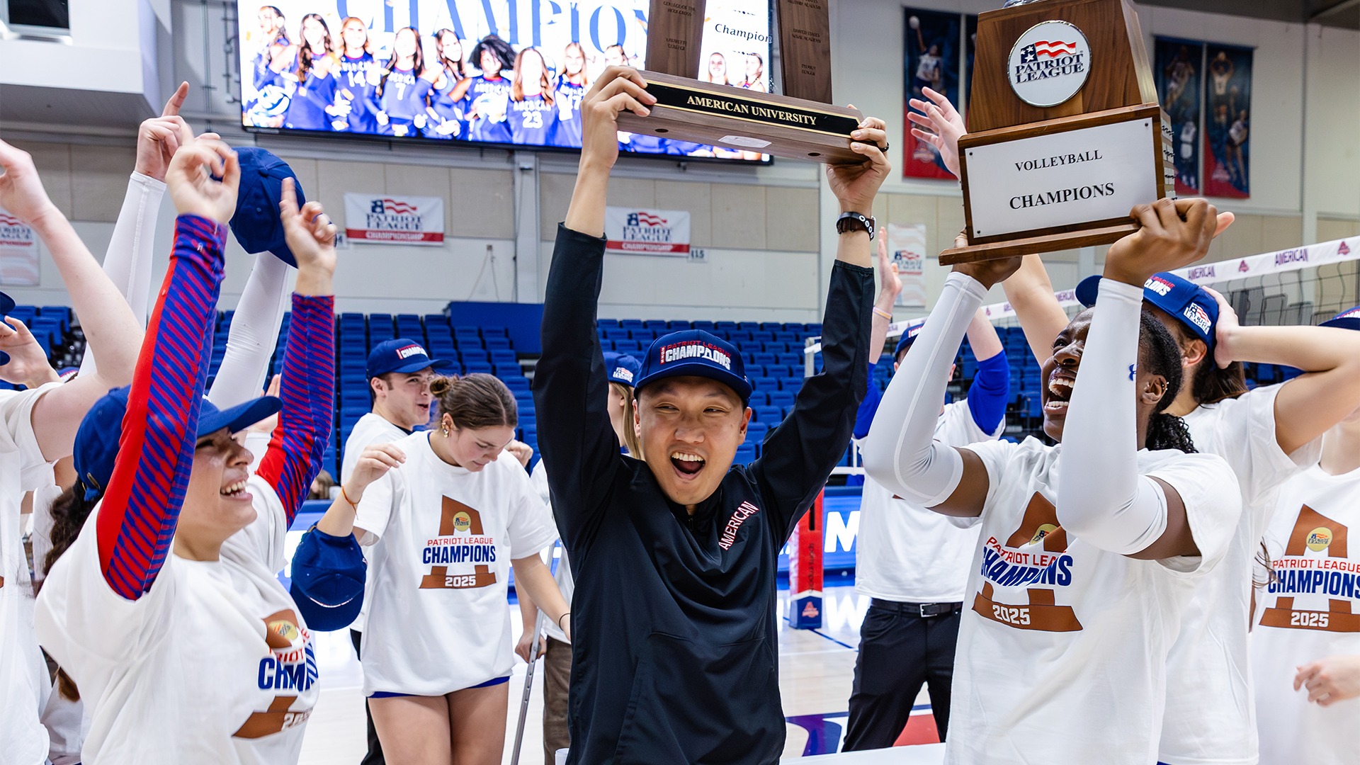 Ahen Kim hoisting the Patriot League Championship trophy.