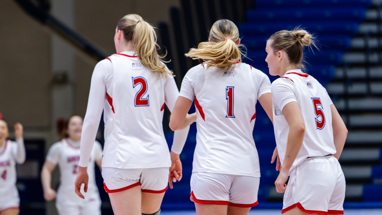 Ellie Pingree, Anna Rescifina, Molly Driscoll side by side on the court as the clock wound down for a win against Boston University.