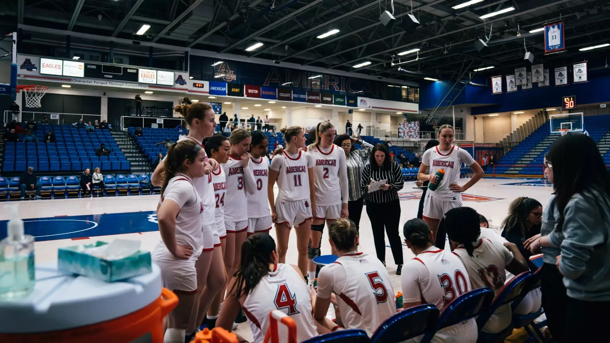 Women's basketball huddled together before the start of their game against Colgate in Bender Arena.