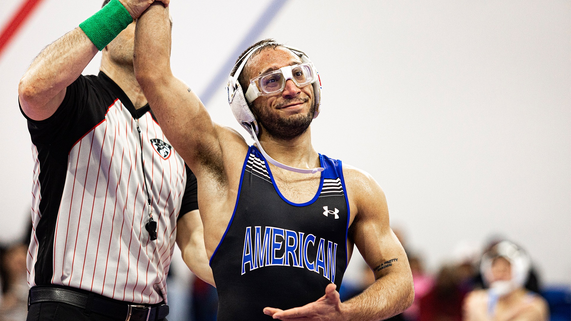 Maximilian Leete getting his arm raised after a win against LIU. 