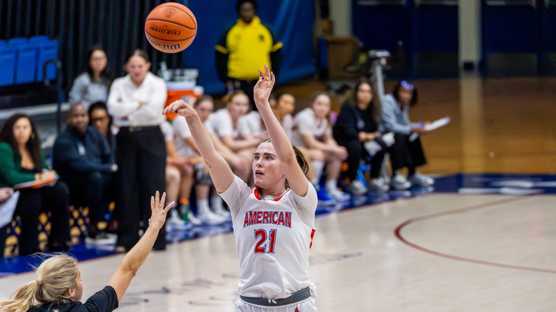 Charlotte Tuhy taking a long-range jump shot against Army in Bender Arena.