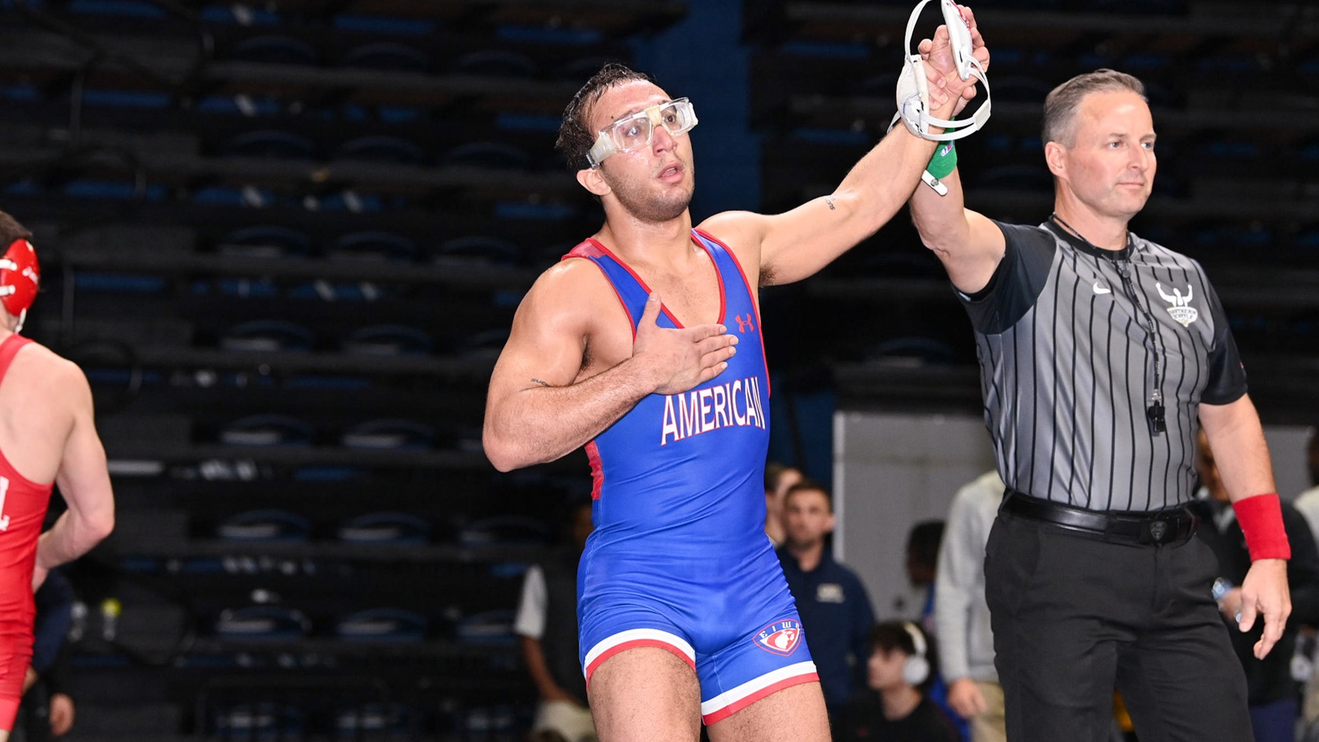Maximilian Leete getting his arm raised by a referee after defeating #15 Tyler Ferrara of Cornell at the 2026 Southern Scuffle.