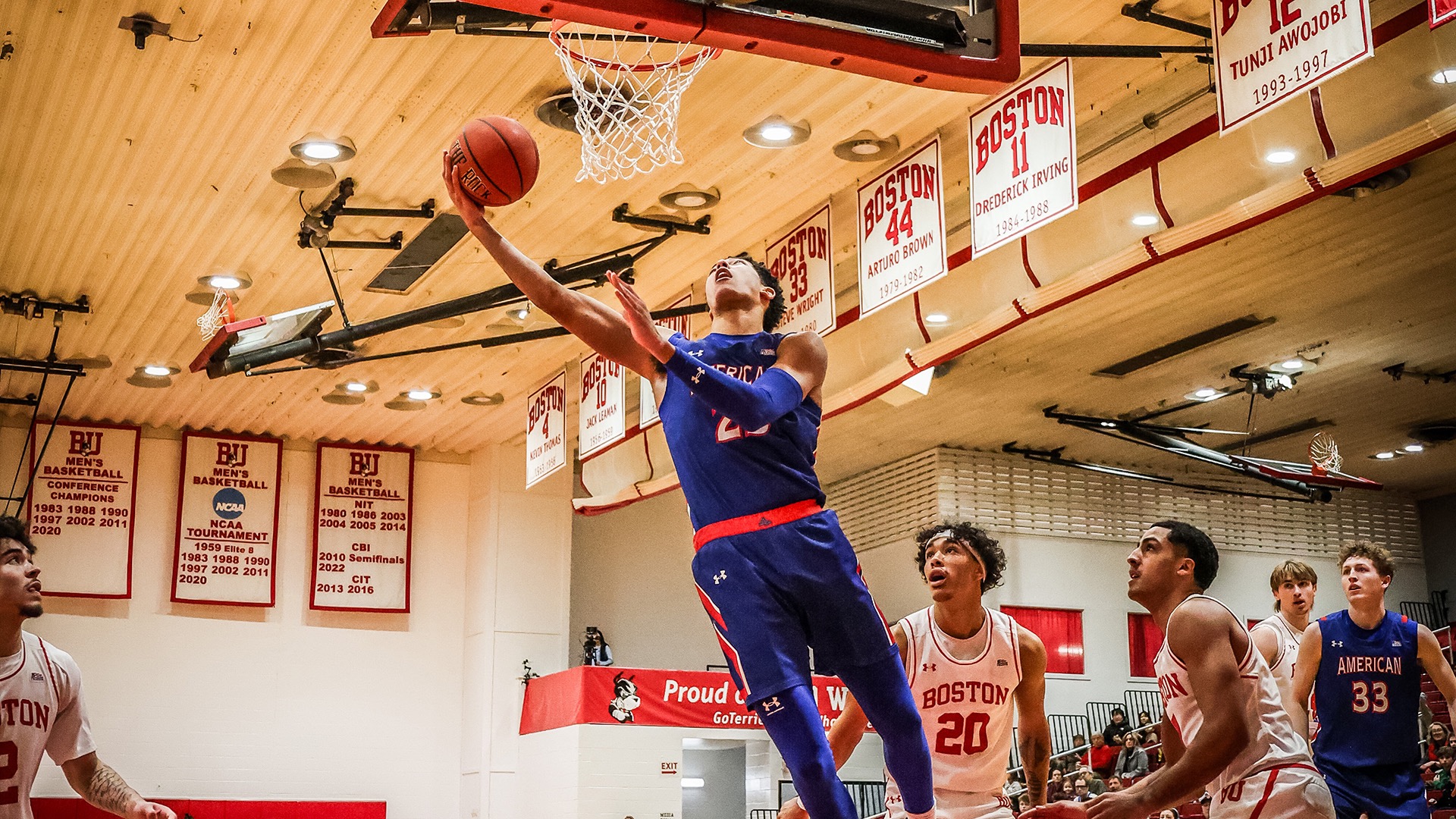Greg Jones going up for a basket in a men's basketball game at Boston University