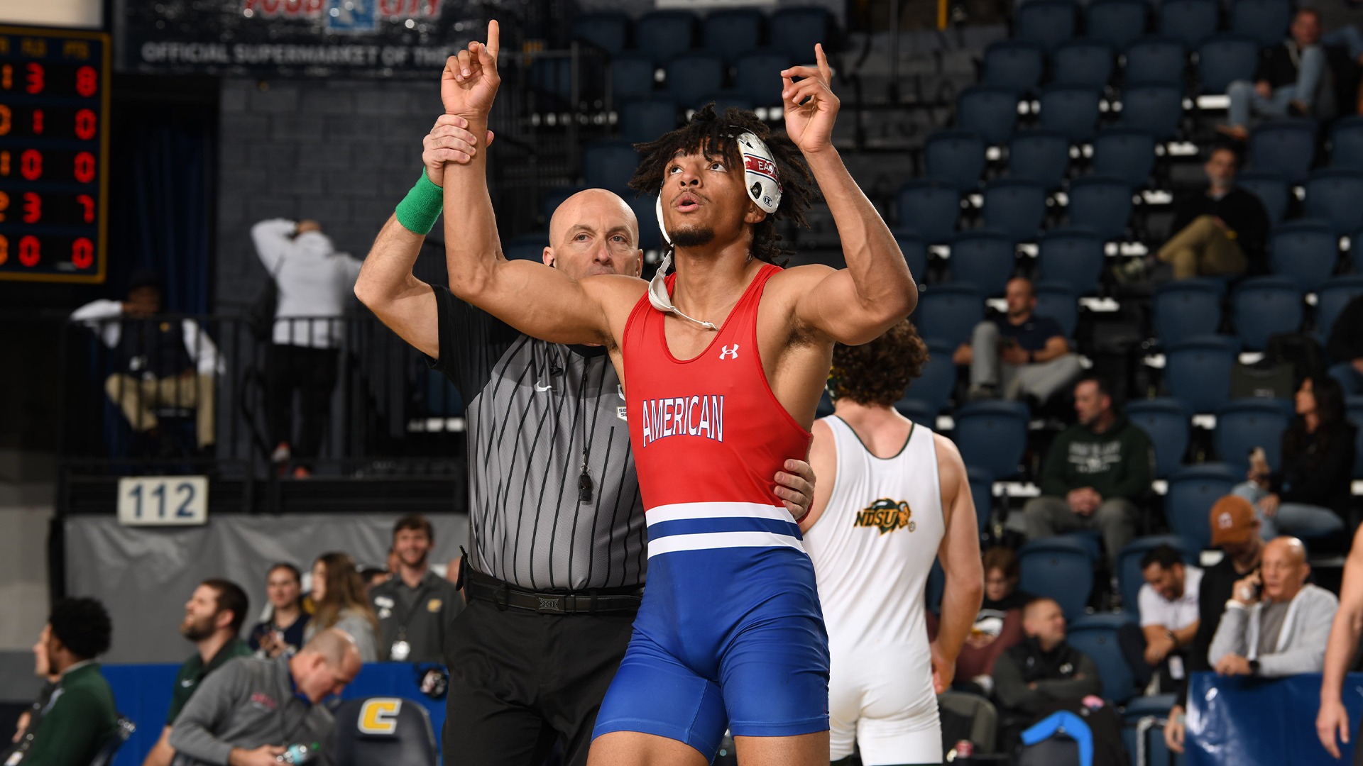 Caleb Campos getting his arm raised at the Southern Scuffle.