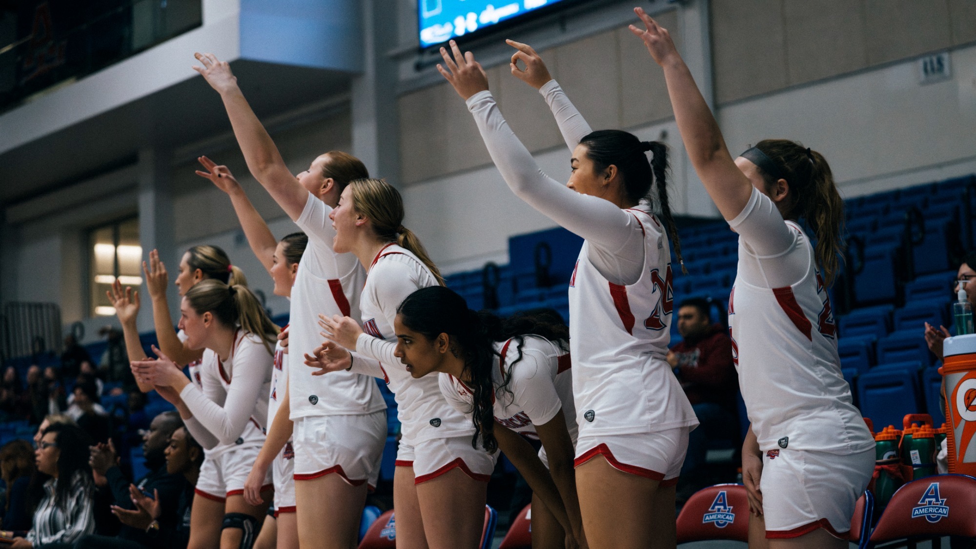 Women's basketball's bench celebrates against Colgate.