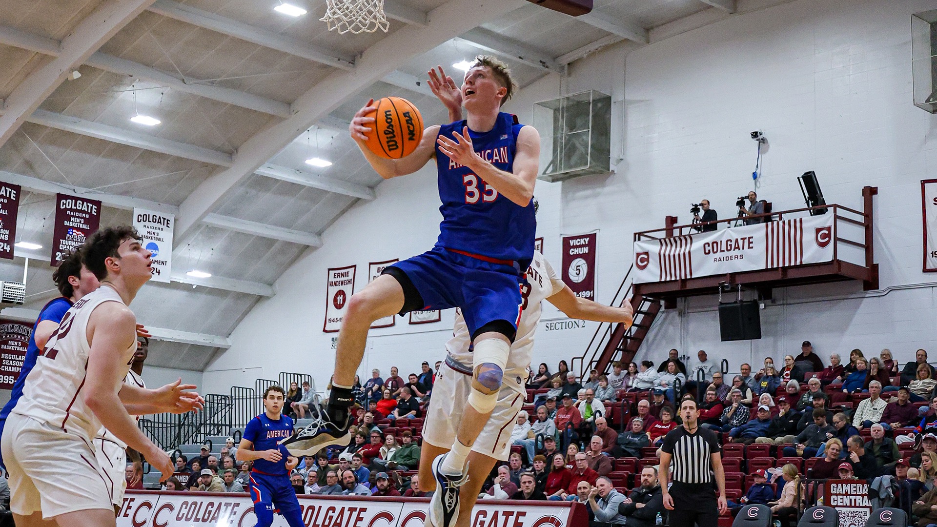 Matt Mayock going up to the basket in a men's basketball game at Colgate