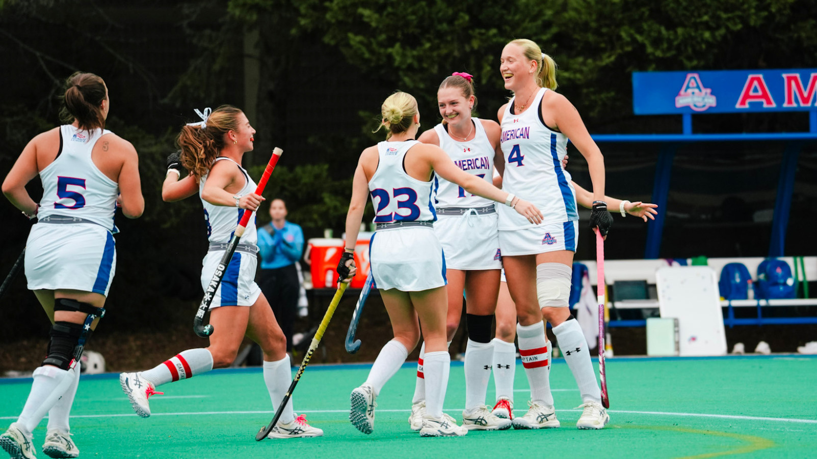 Sophie Willemse celebrates a goal with teammates.