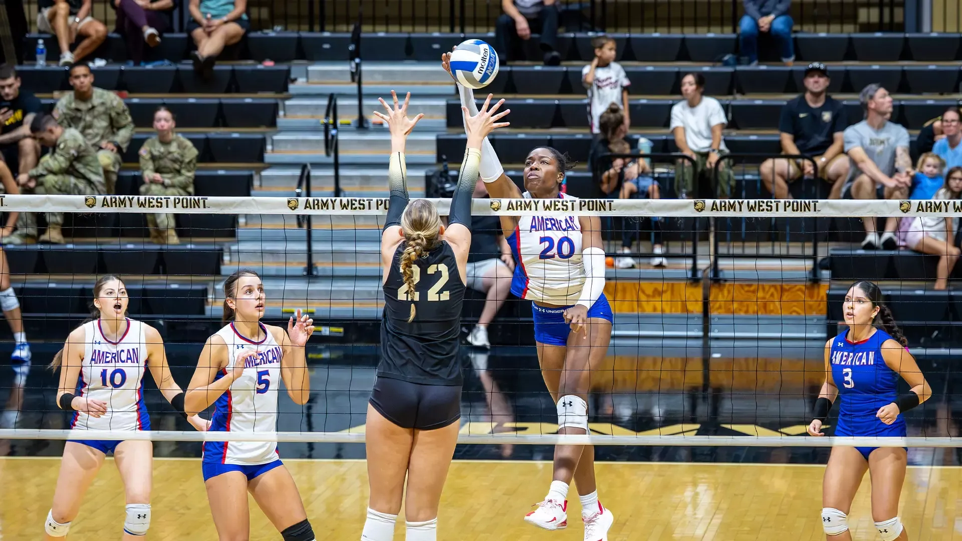 Prinzez Zeck jumping up for an attack attempt in a volleyball match against Army at West Point. 