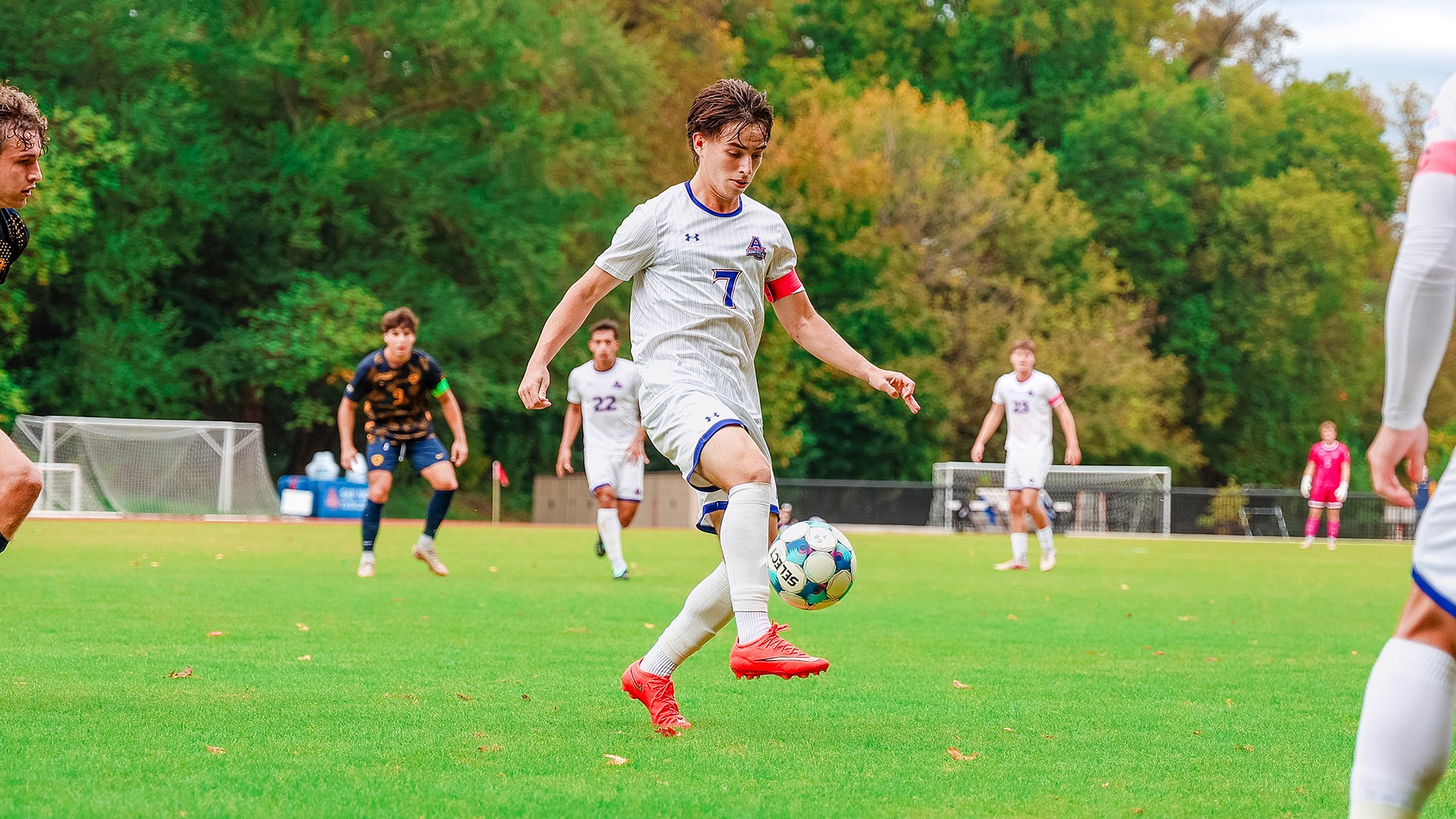 Chris Sullivan with the ball in a men's soccer game