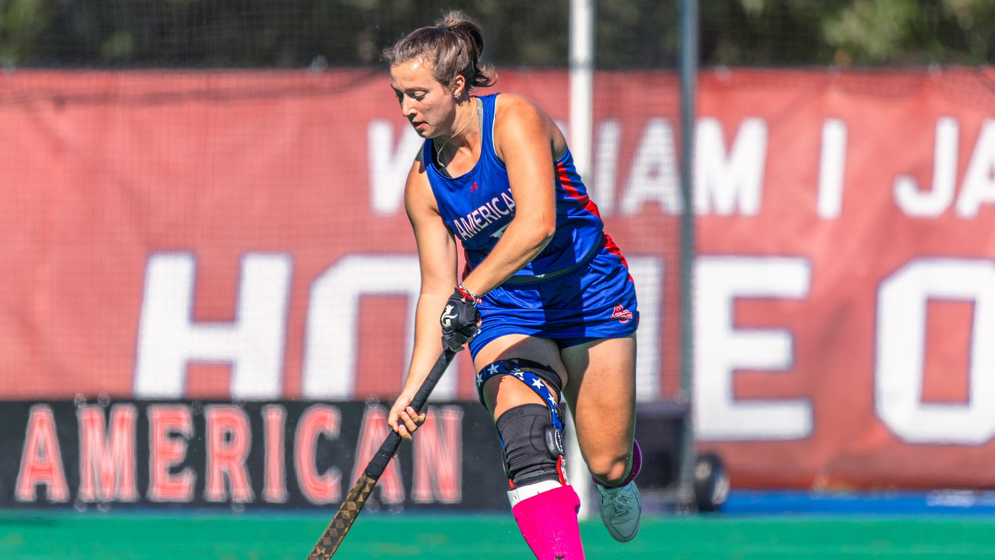 Kaleigh Missimer carrying the ball down the field against Georgetown.