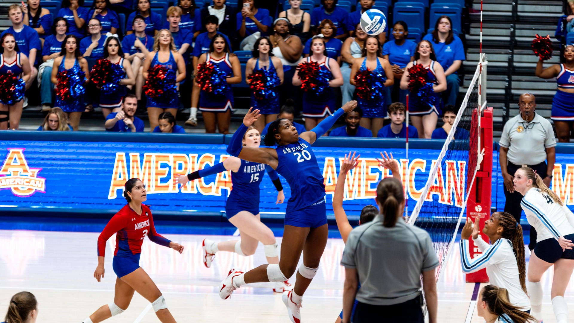 Prinzez Zeck jumping for an attack attempt in a volleyball match.