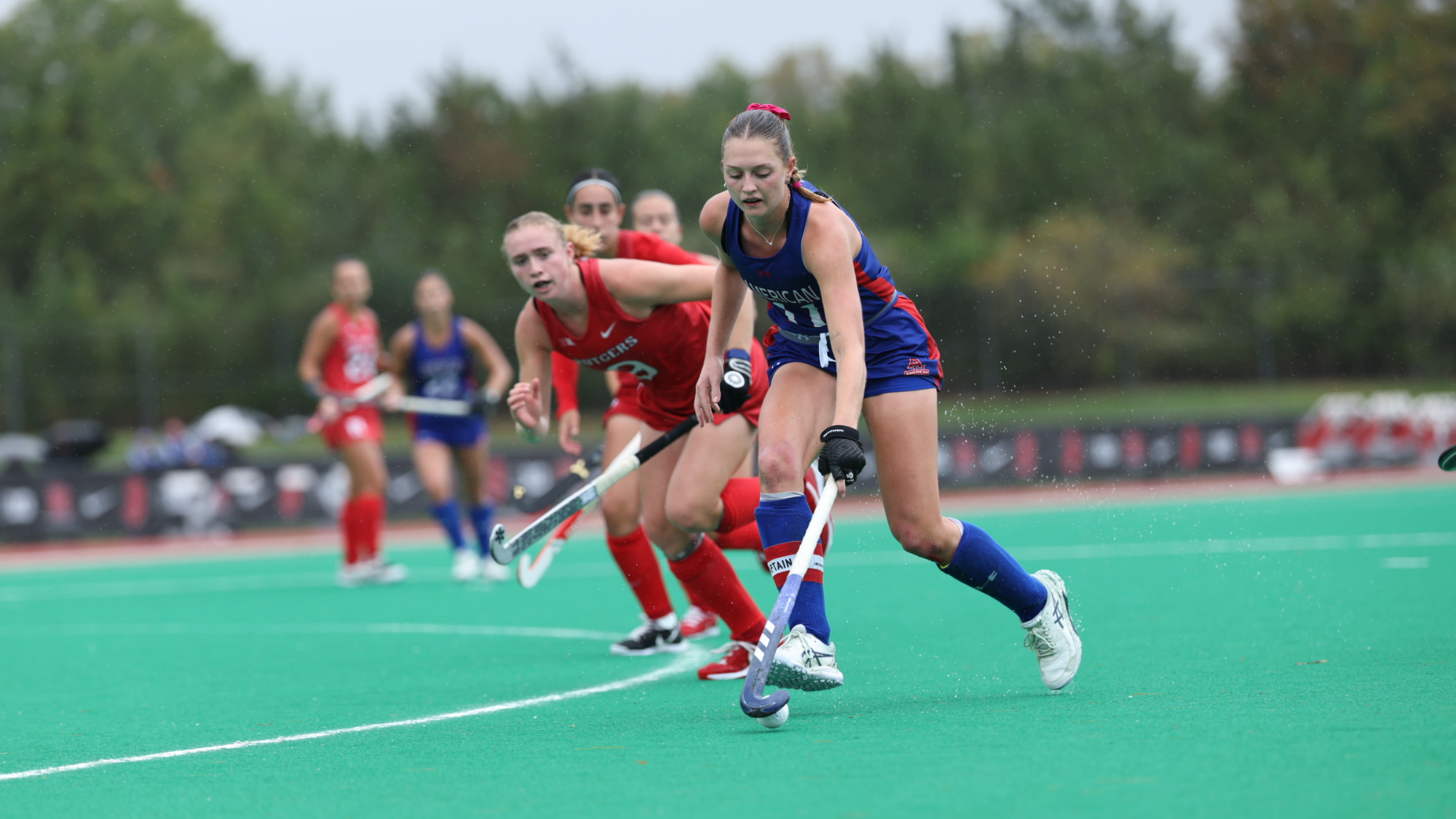 Emilia Winkler carrying the ball through the midfield at Rutgers.