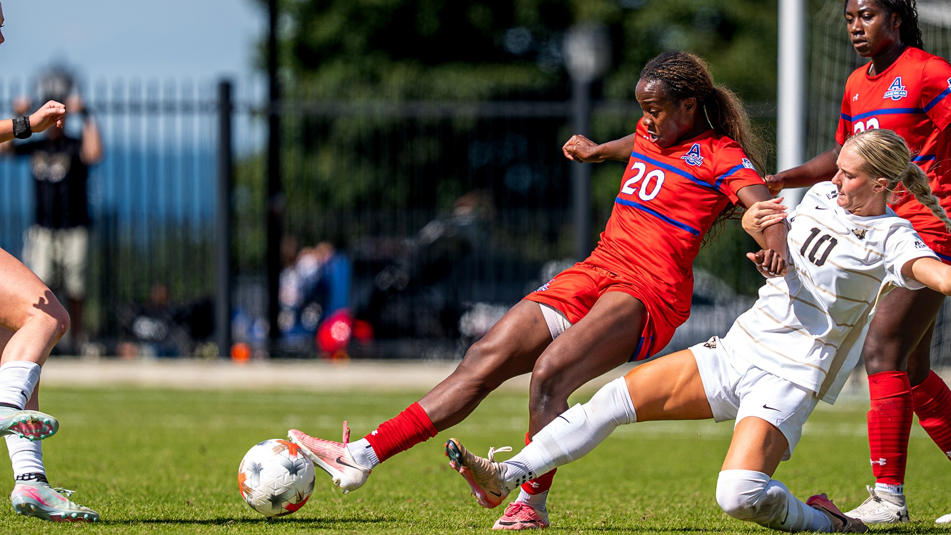 Lauren Sanders sliding to kick the ball in a women's soccer game at Army
