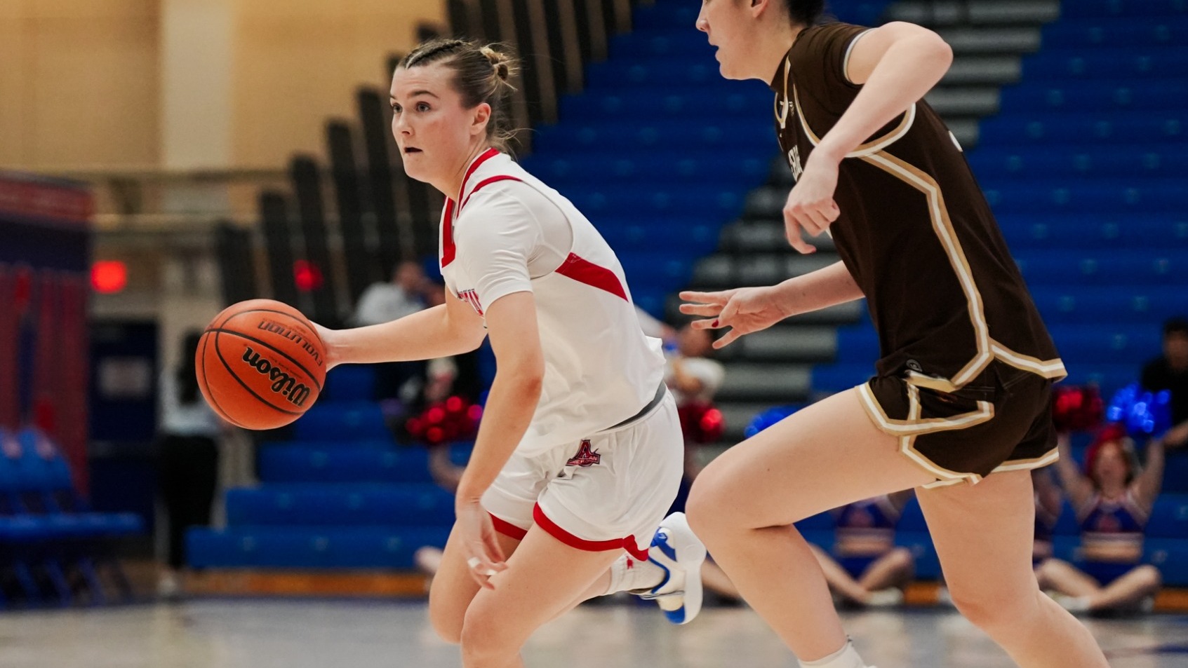 Molly Driscoll driving past a Lehigh defender.