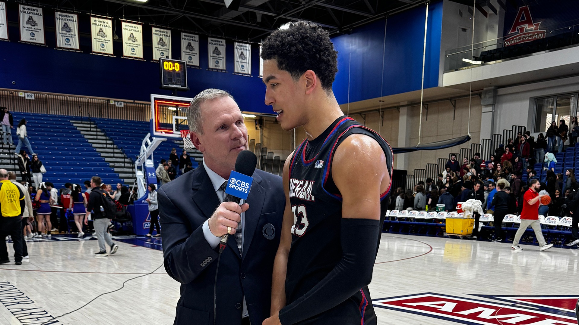 Greg Jones talking to Mo Cassara of CBS Sports Network after a men's basketball win