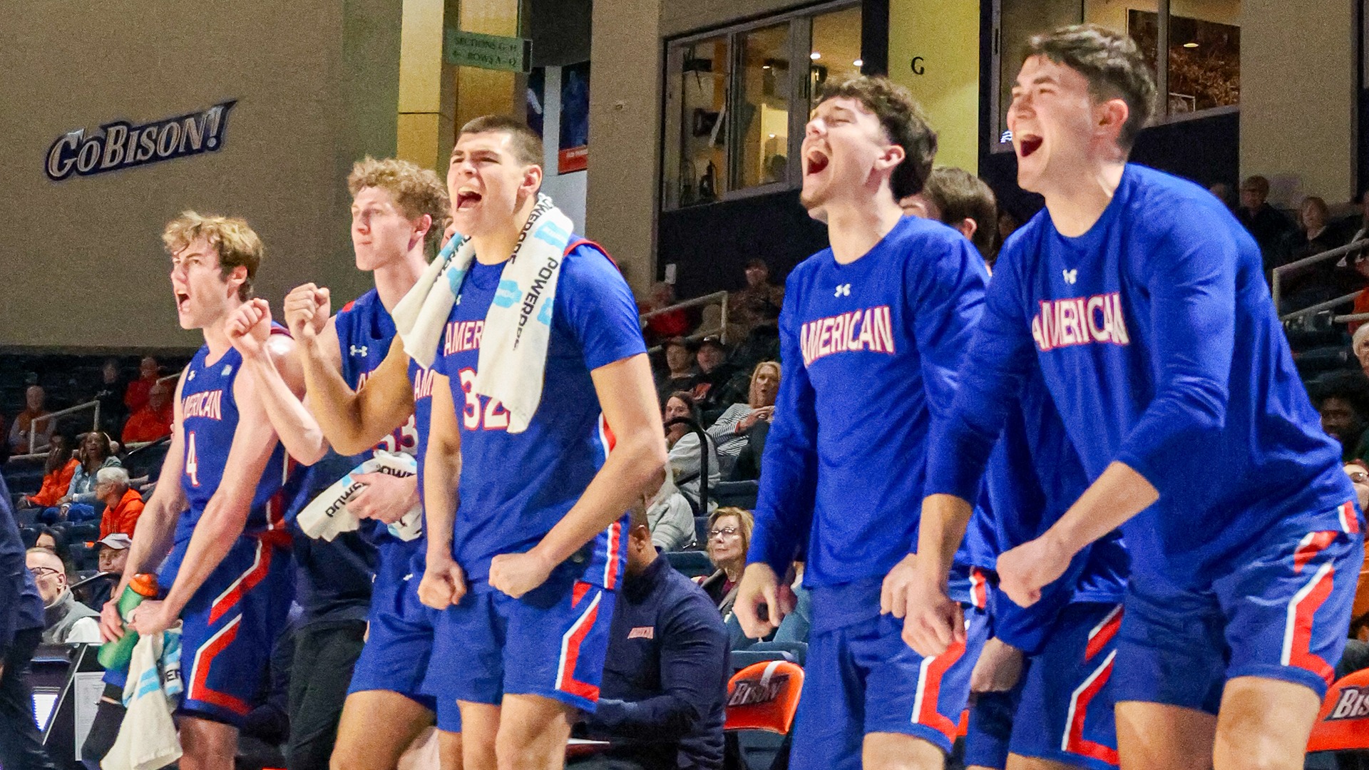 men's basketball players celebrating during a win at Bucknell