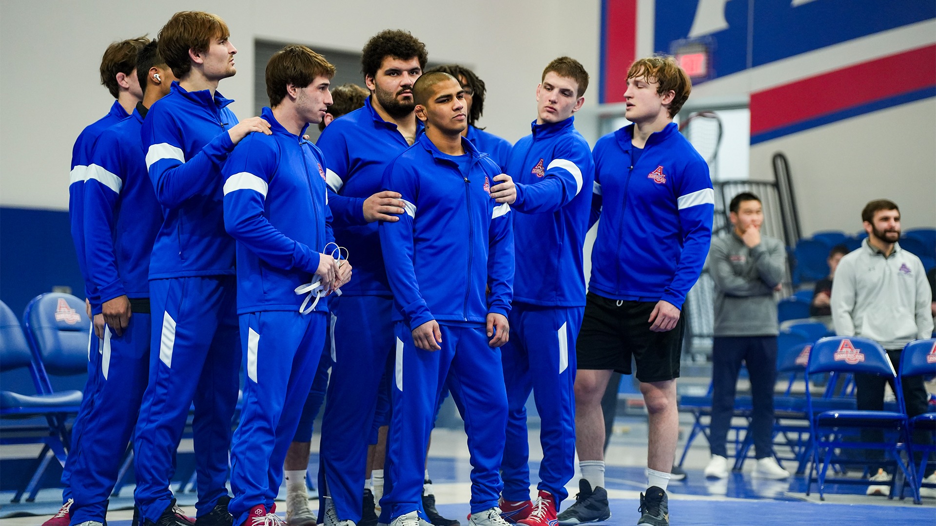 Raymond Lopez with his teammates before a wrestling match.