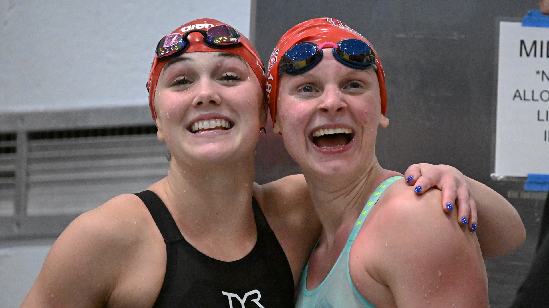 Marin Priddy and Piper Crosby smiling at the Patriot League Swim & Dive Championships in 2026