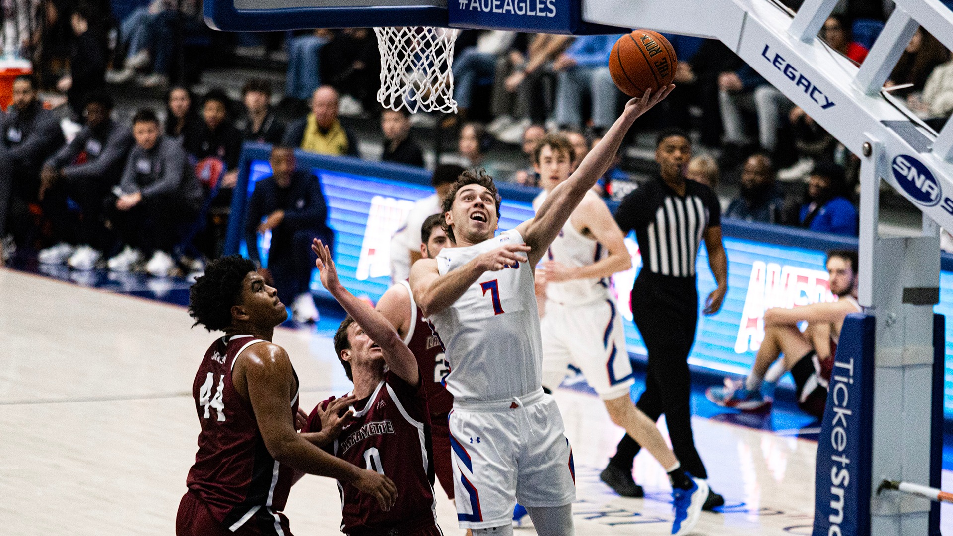 Wyatt Nausadis going up for a shot in a men's basketball game against Lafayette