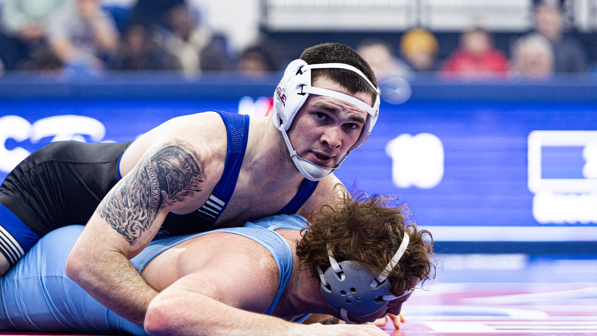 Hunter Hohman wrestling in a match against LIU.