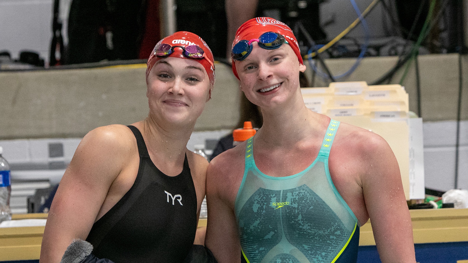 Marin Priddy and Piper Crosby smiling together at the 2026 Patriot League Swim & Dive Championships