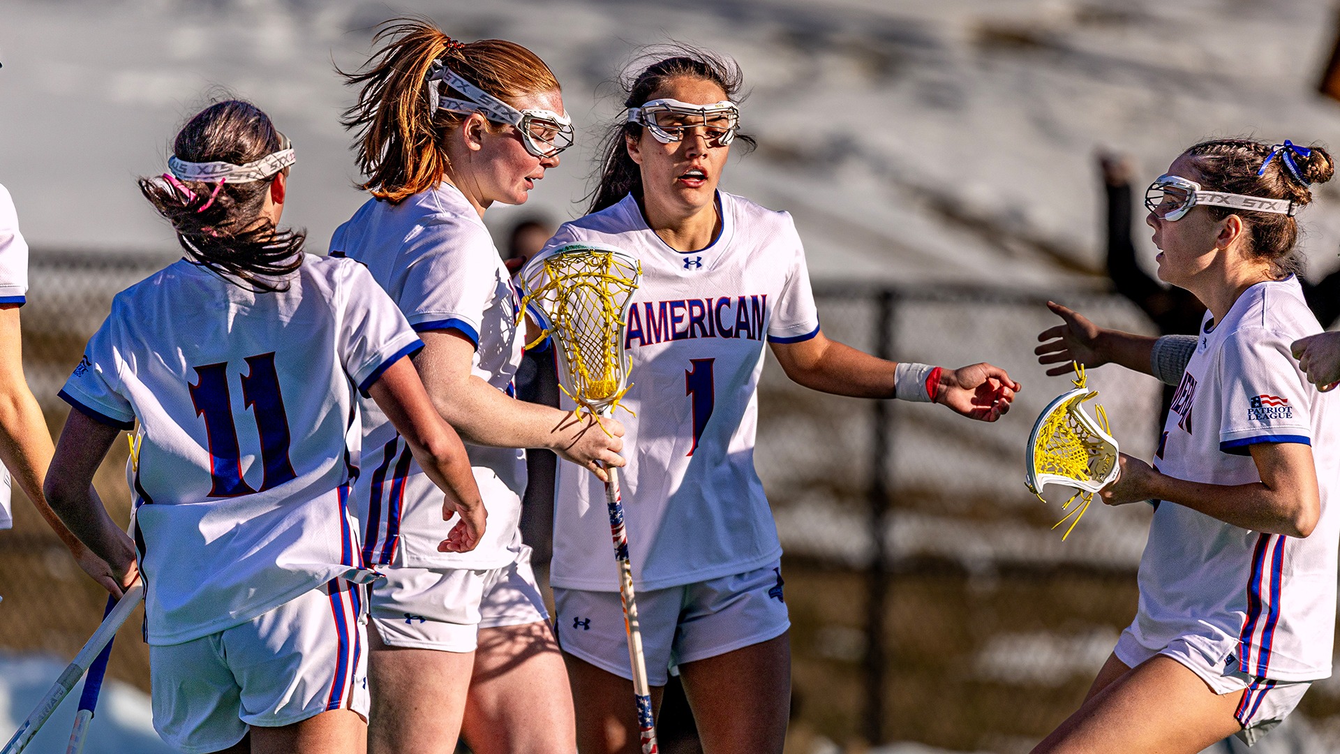 Adria Kotzian and Annabelle Jackson huddling after a goal. 