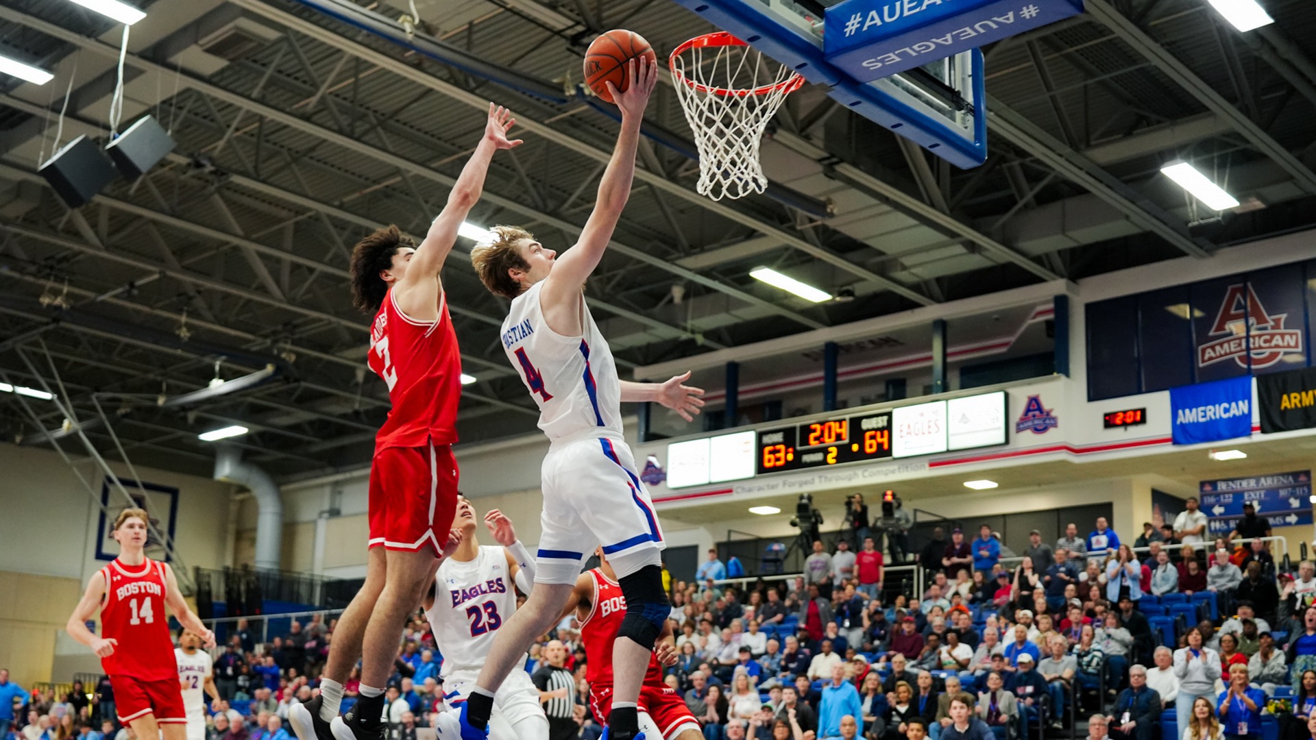 Kade Sebastian making a layup in a men's basketball game against Boston University