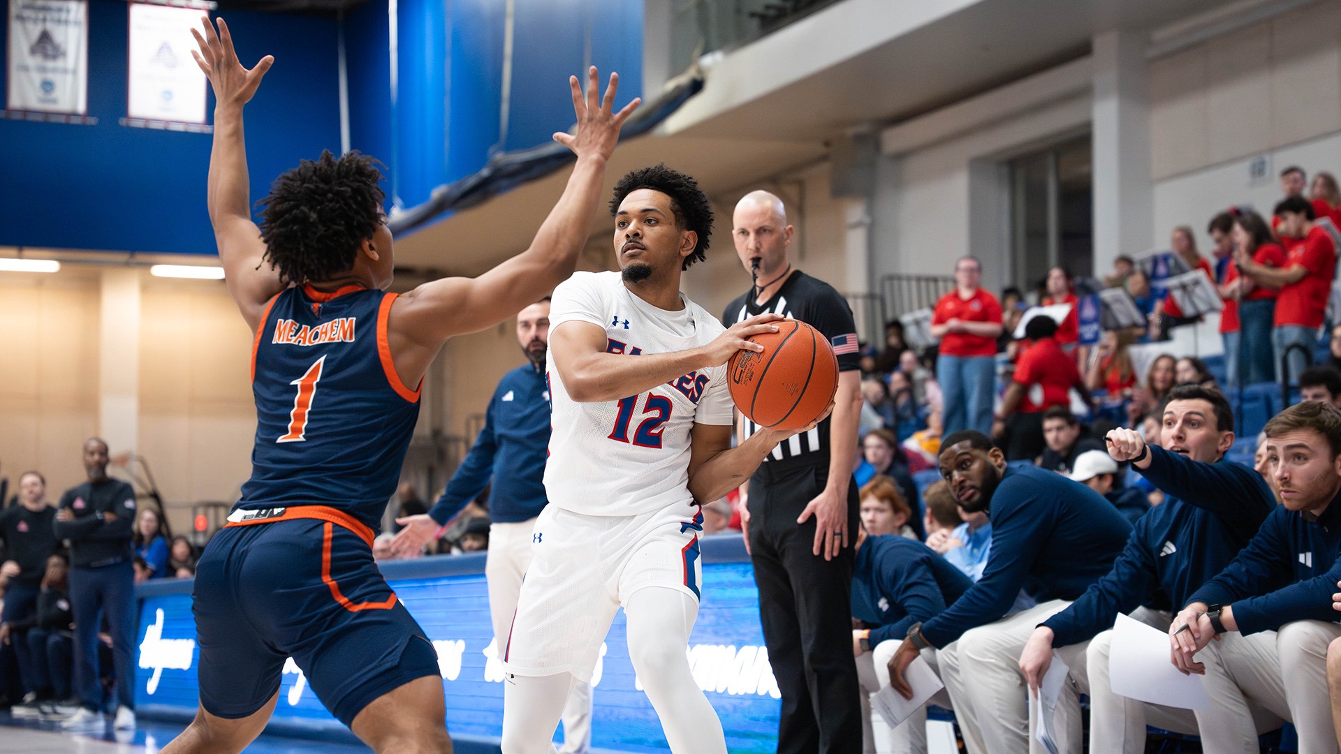 Geoff Sprouse with the ball during a men's basketball game against Bucknell