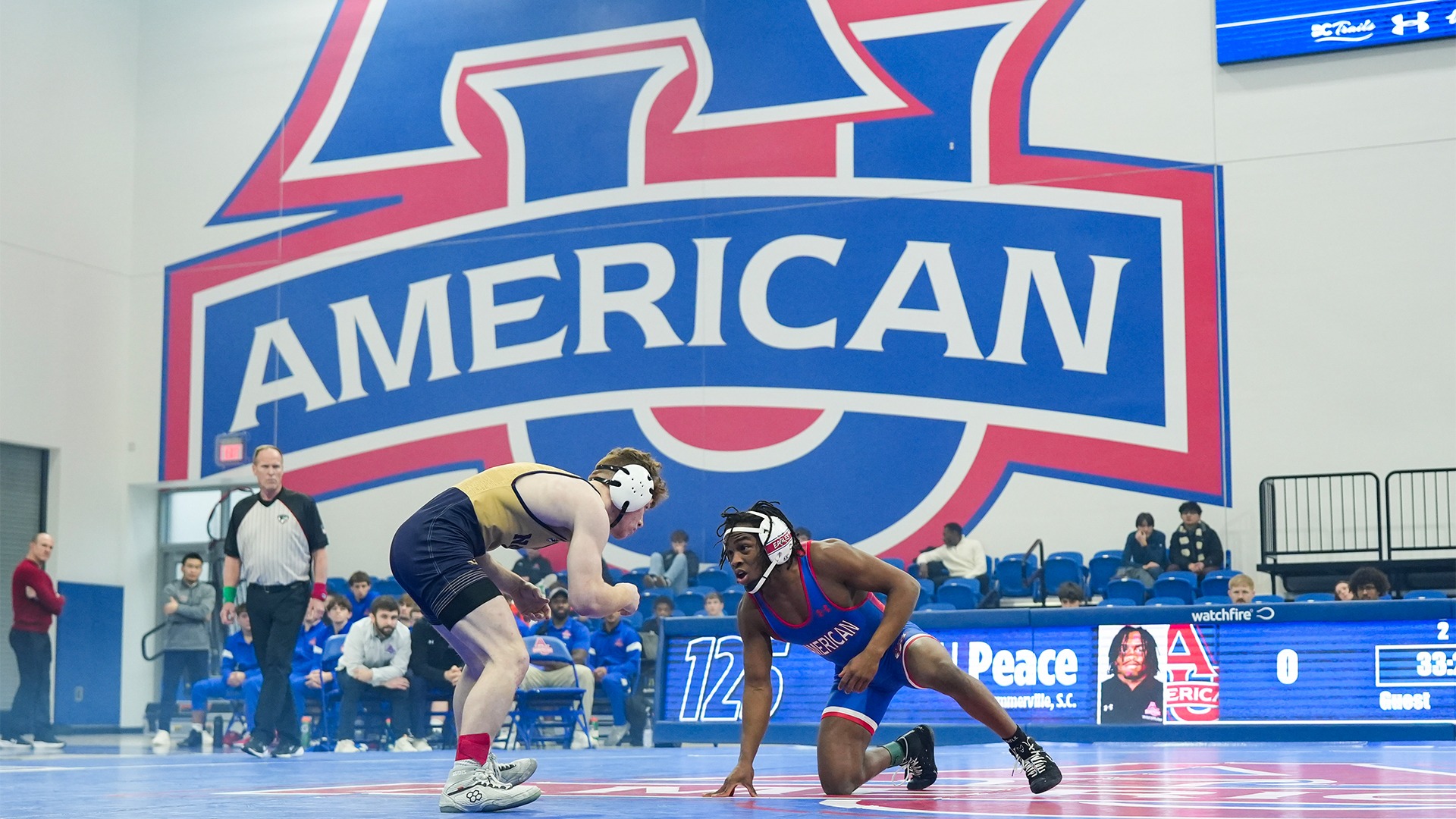 JJ Peace wrestling in a match against Navy at the Meltzer Center. 