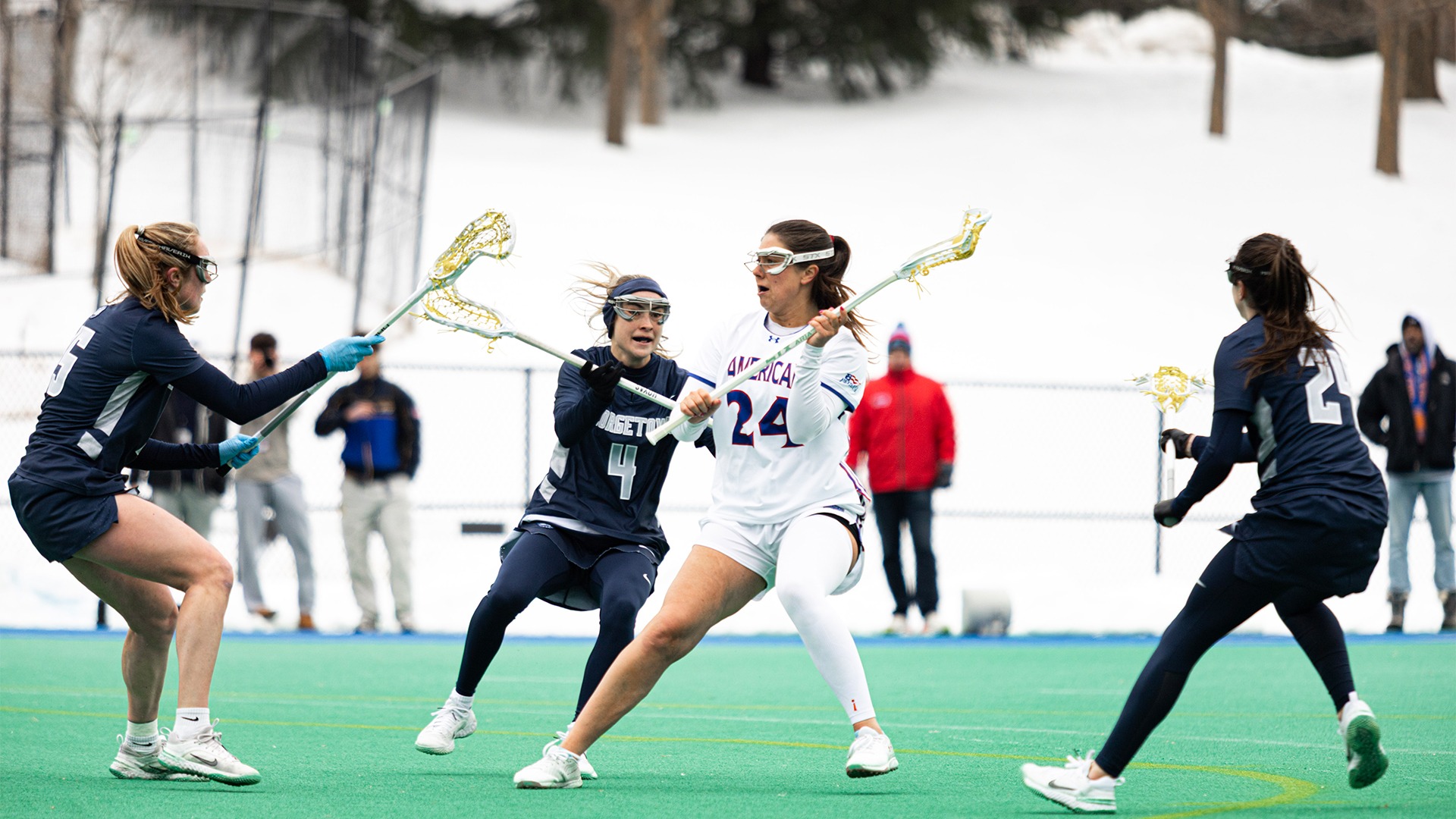 Reagan Murdoch passing the ball in a lacrosse game against Georgetown.