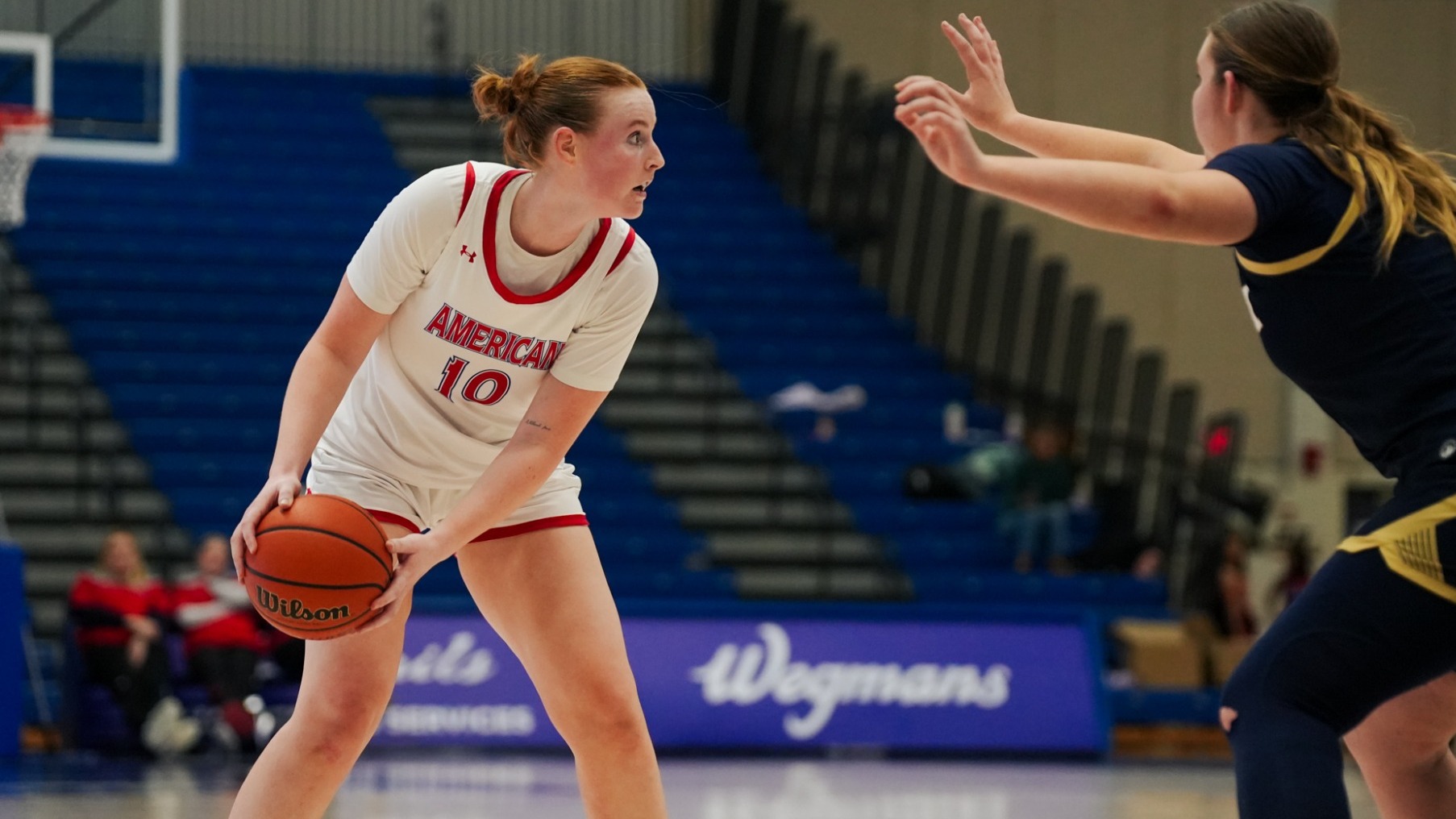Grace Koepke facing off with a member of the Navy squad.