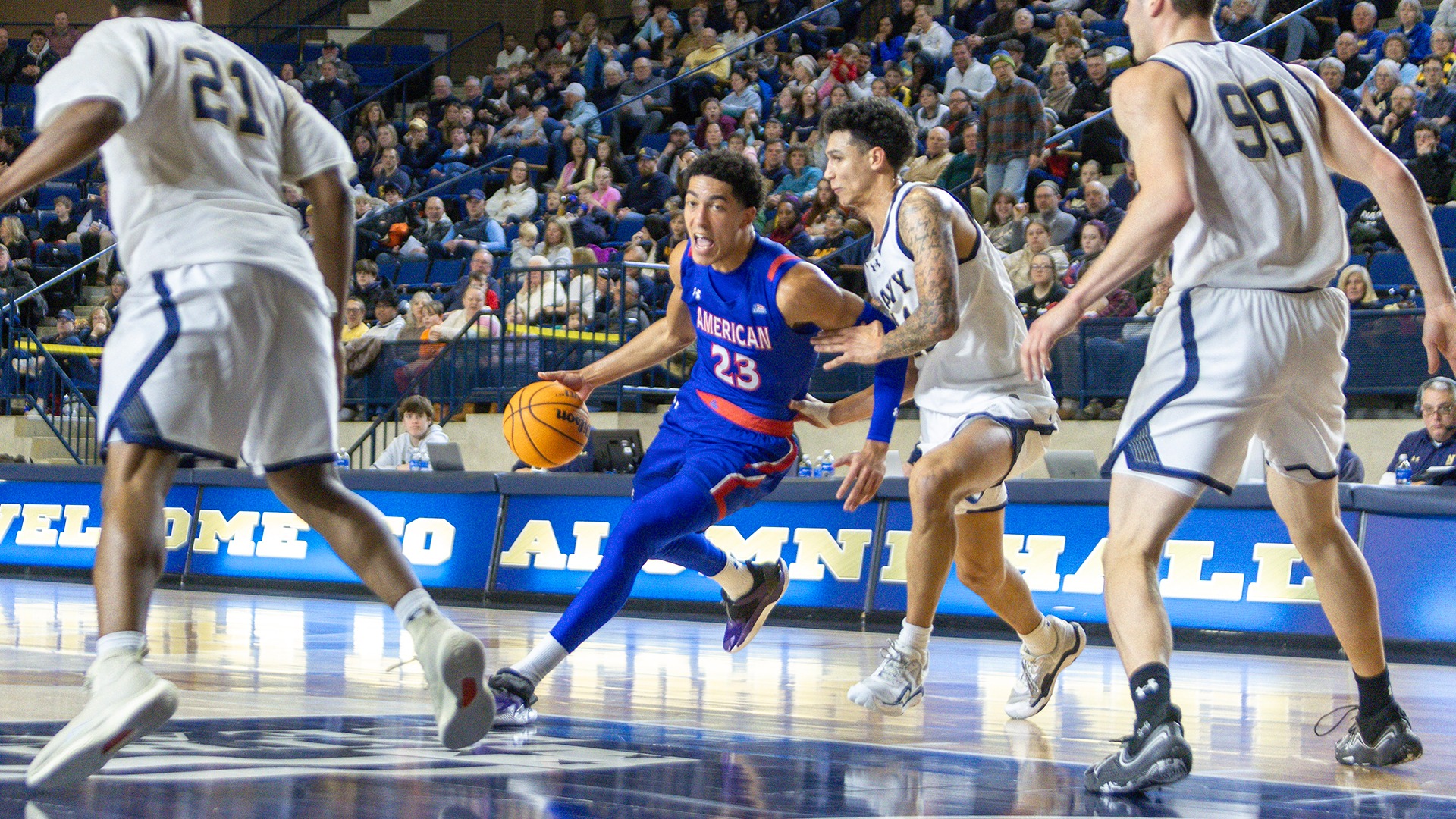 Greg Jones with the ball during a men's basketball game at Navy